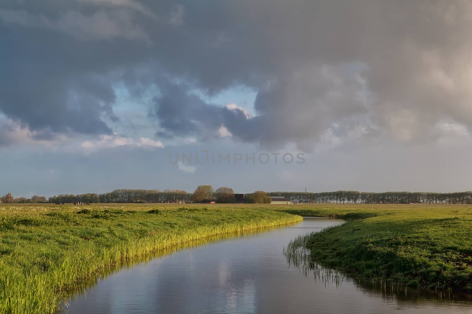 cloud sky over river in Dutch farmland by catolla