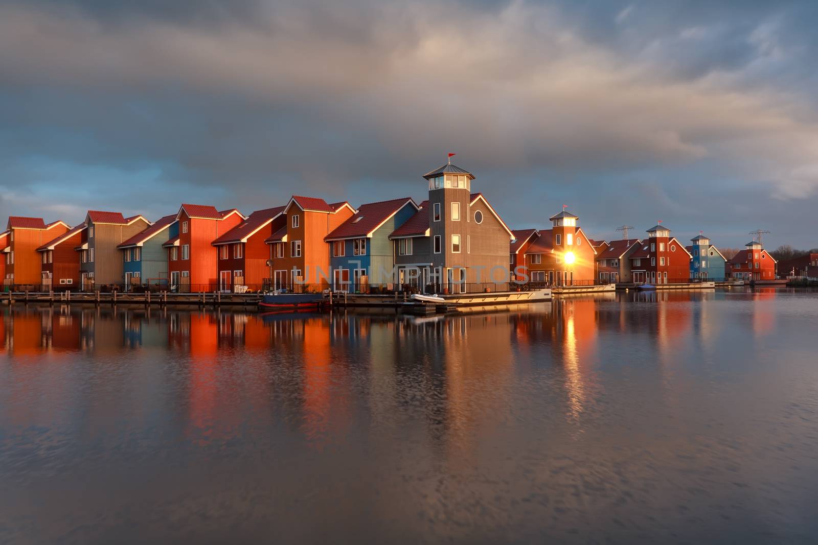 colorful buildings on water  in morning sunshine, Groningen, Netherlands