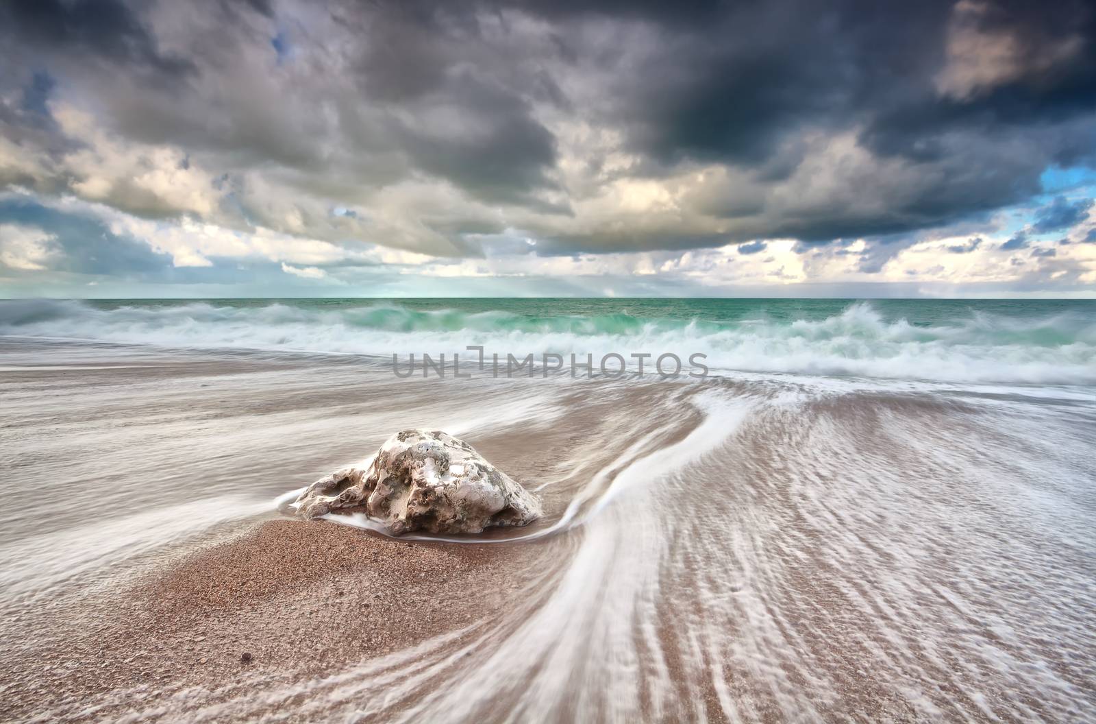 clouded sky and ocean waves with long exposure, Etretat, France