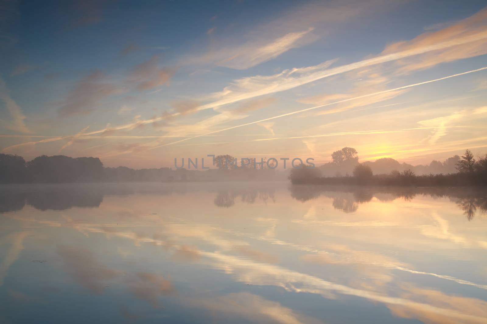 misty sunrise over river, Drenthe, Netherlands