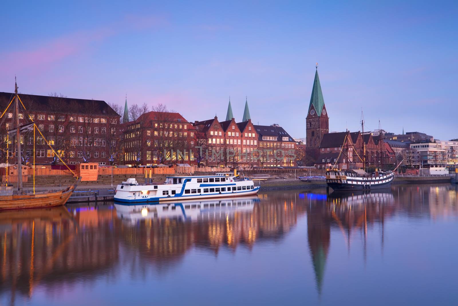 pink sunset over river in Bremen city, Germany