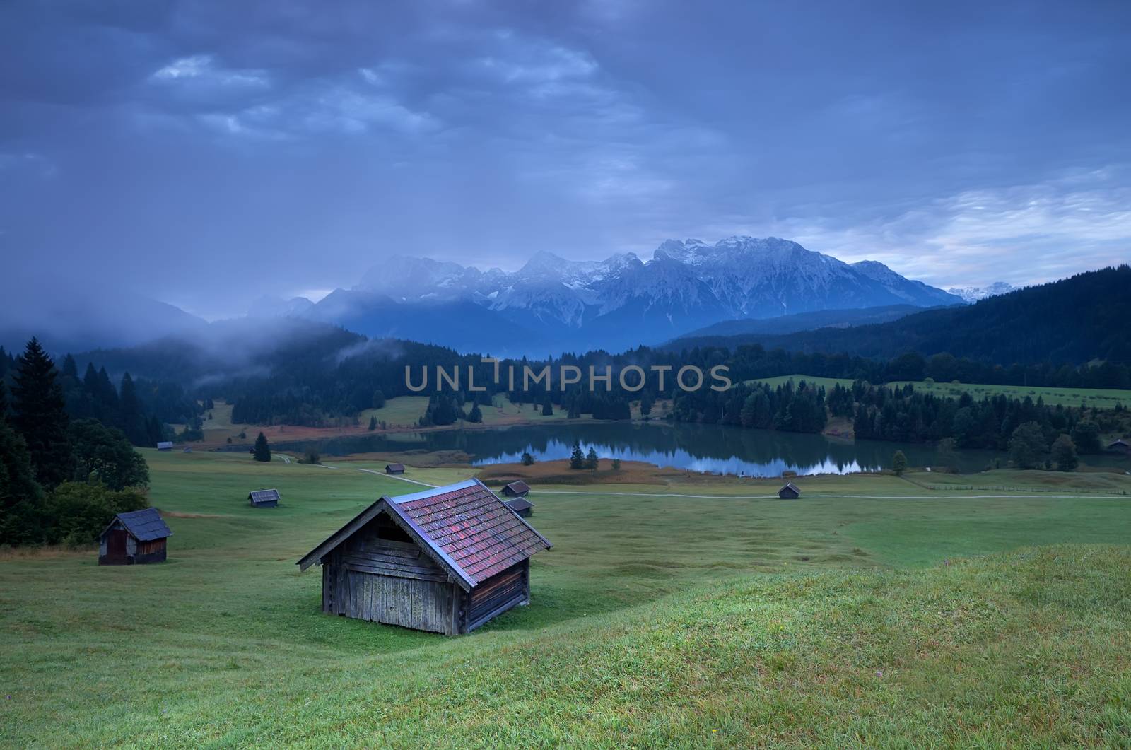 wooden hut on alpine meadow by Geroldsee lake, Bavaria, Germany