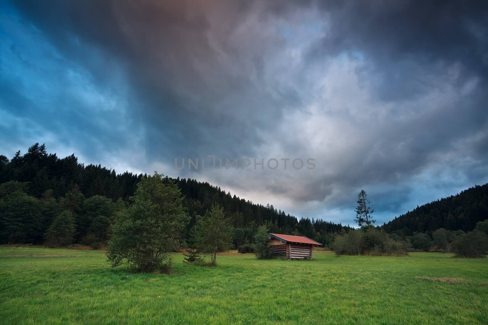 stormy sunset over alpine meadows, Bavaria, Germany