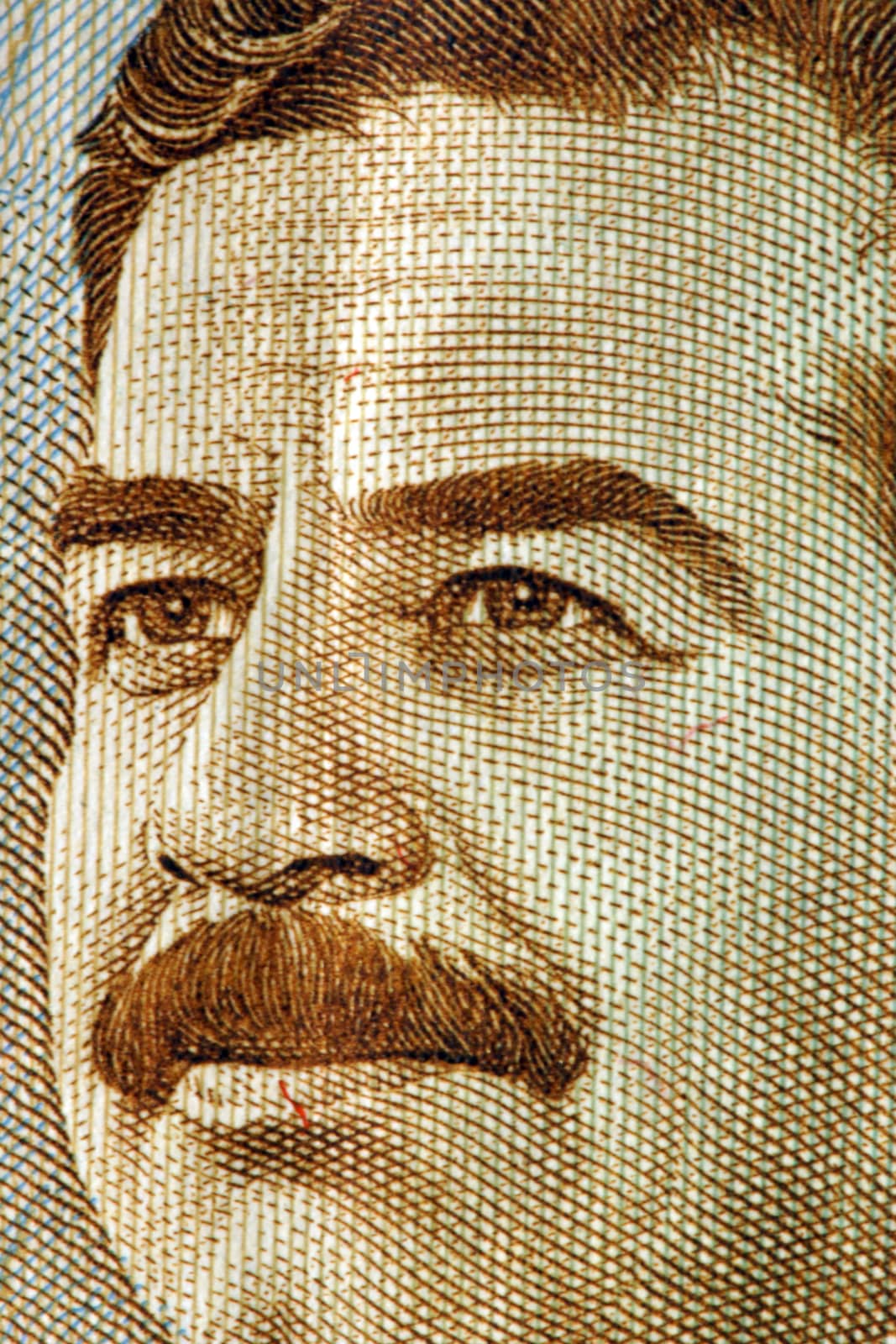 A close up saddam hussein on an iraqi dinar