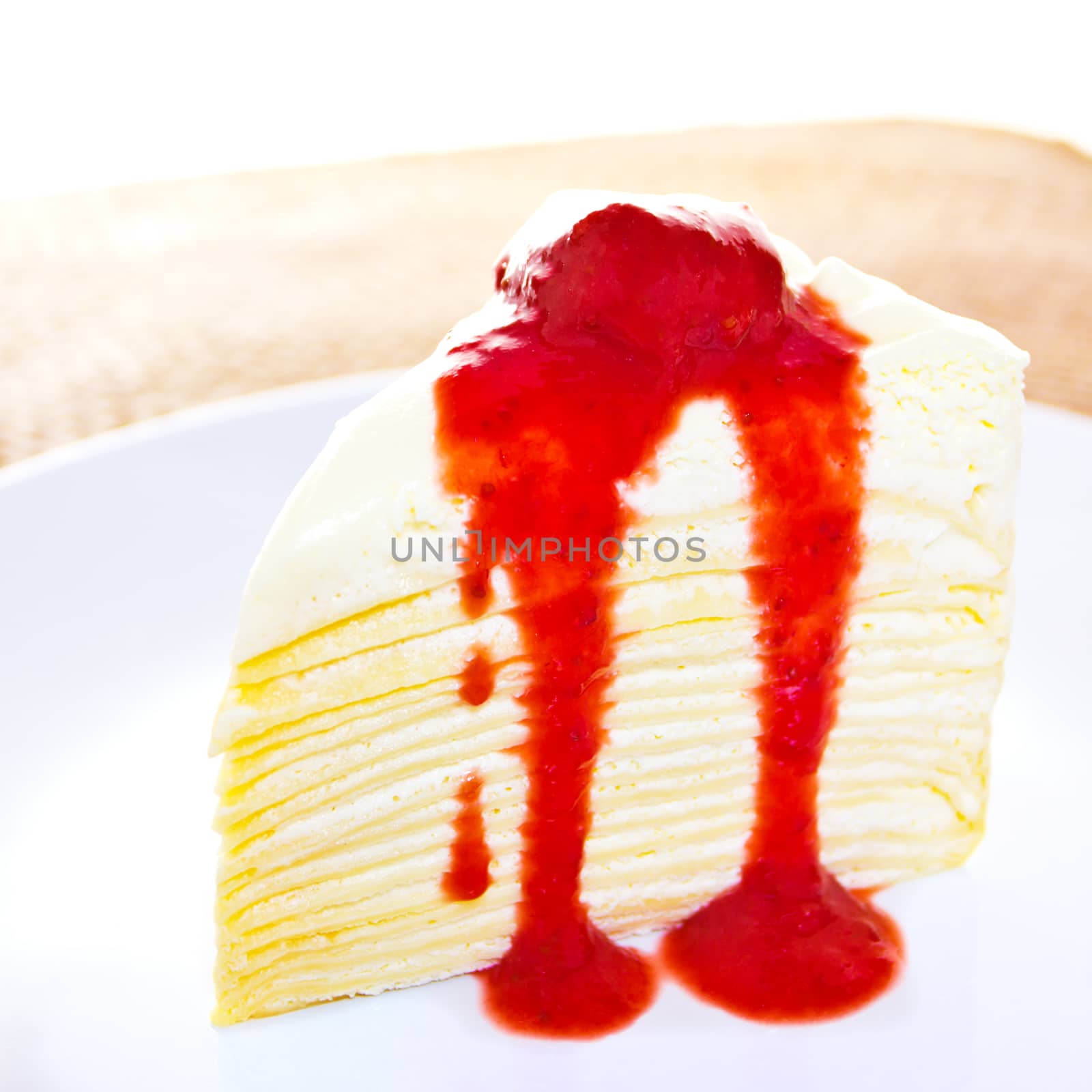 Crepe cake with strawberry sauce  by wyoosumran