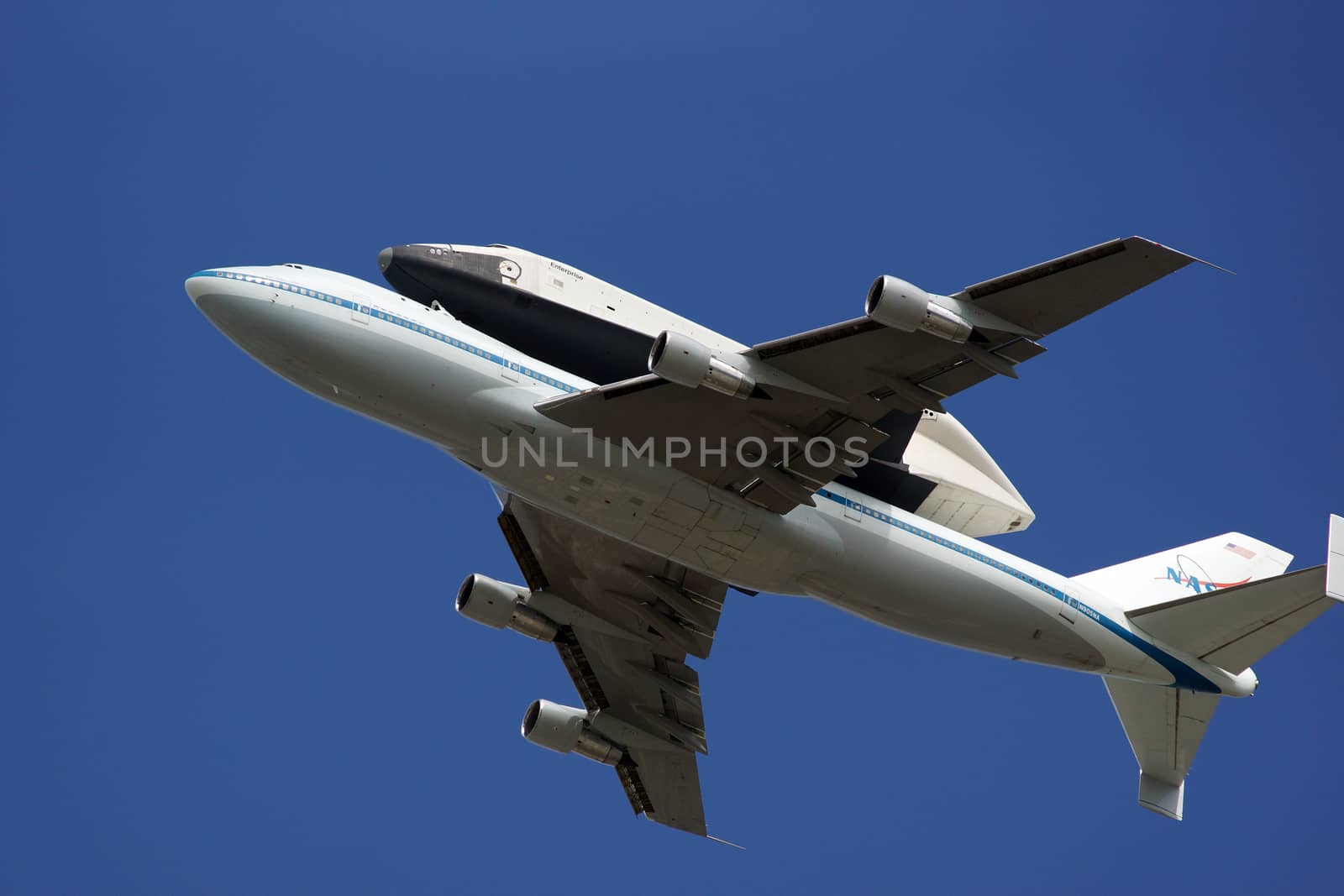 A space shuttle atop a flying 747 plane