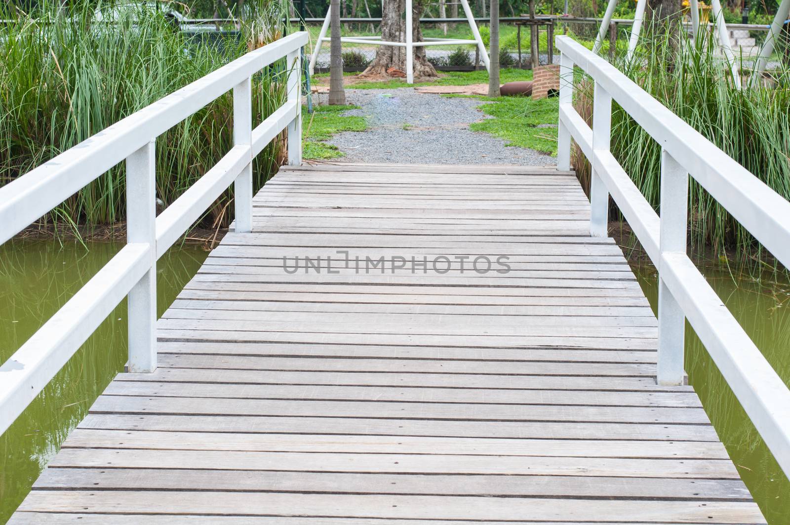 White wooden bridge for across the river