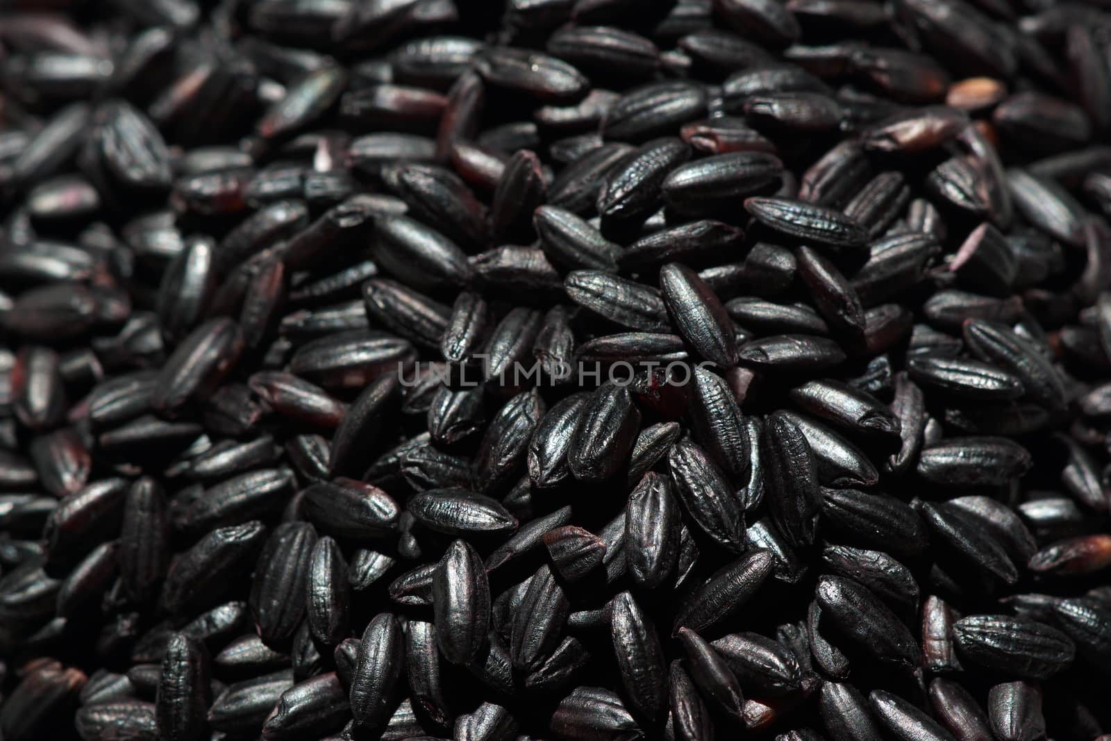A pile of black grain rice seen from above