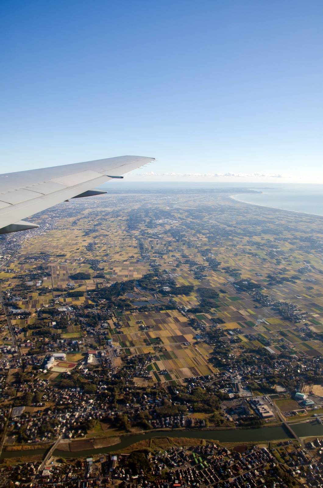 Aerial view from the window of an airplane of a populated area 