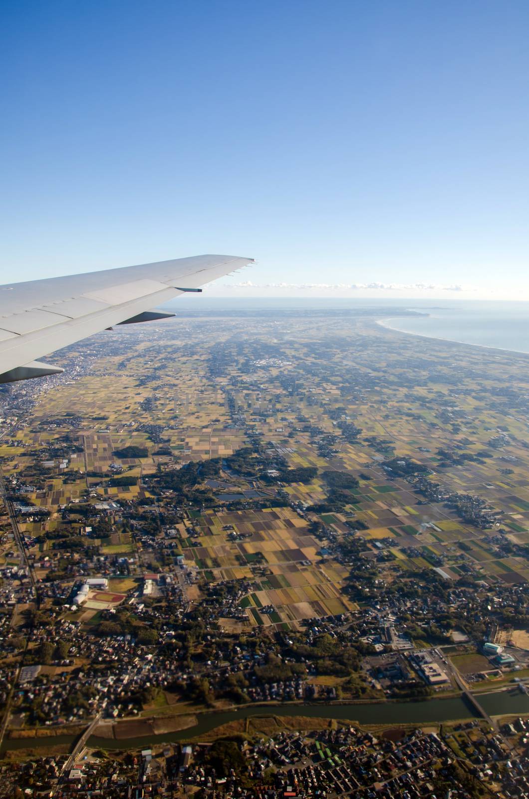 Aerial view from the window of an airplane by siraanamwong