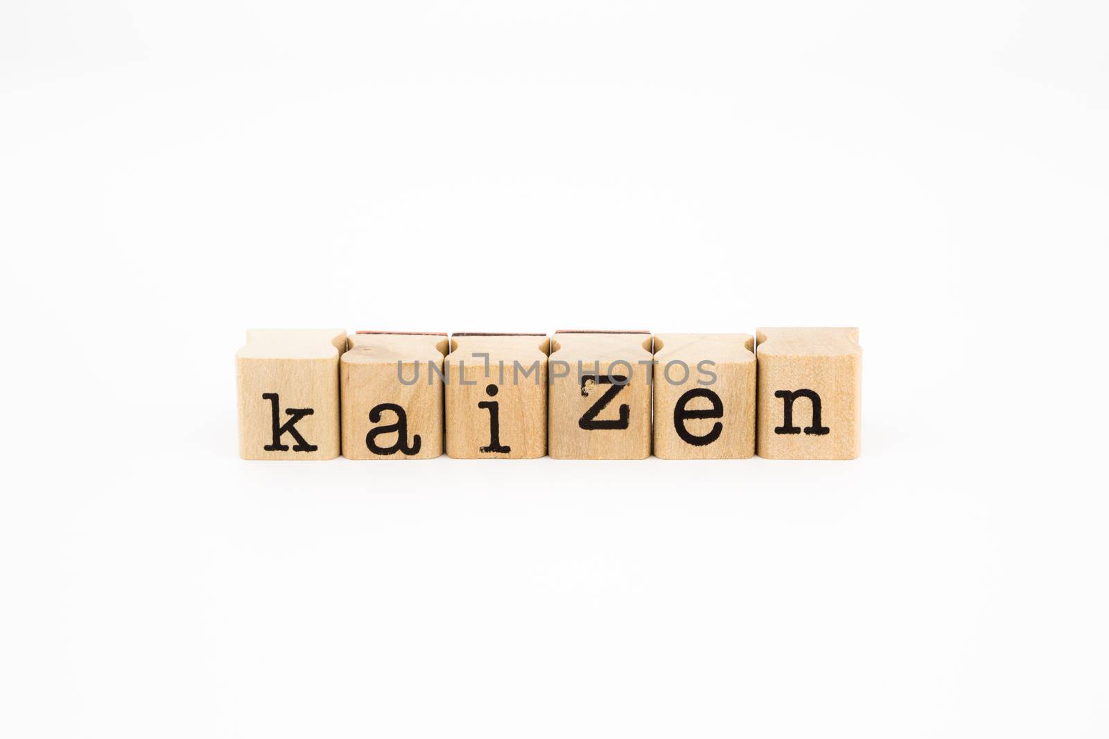 closeup kaizen wording isolate on white background, business and productivity concept and idea