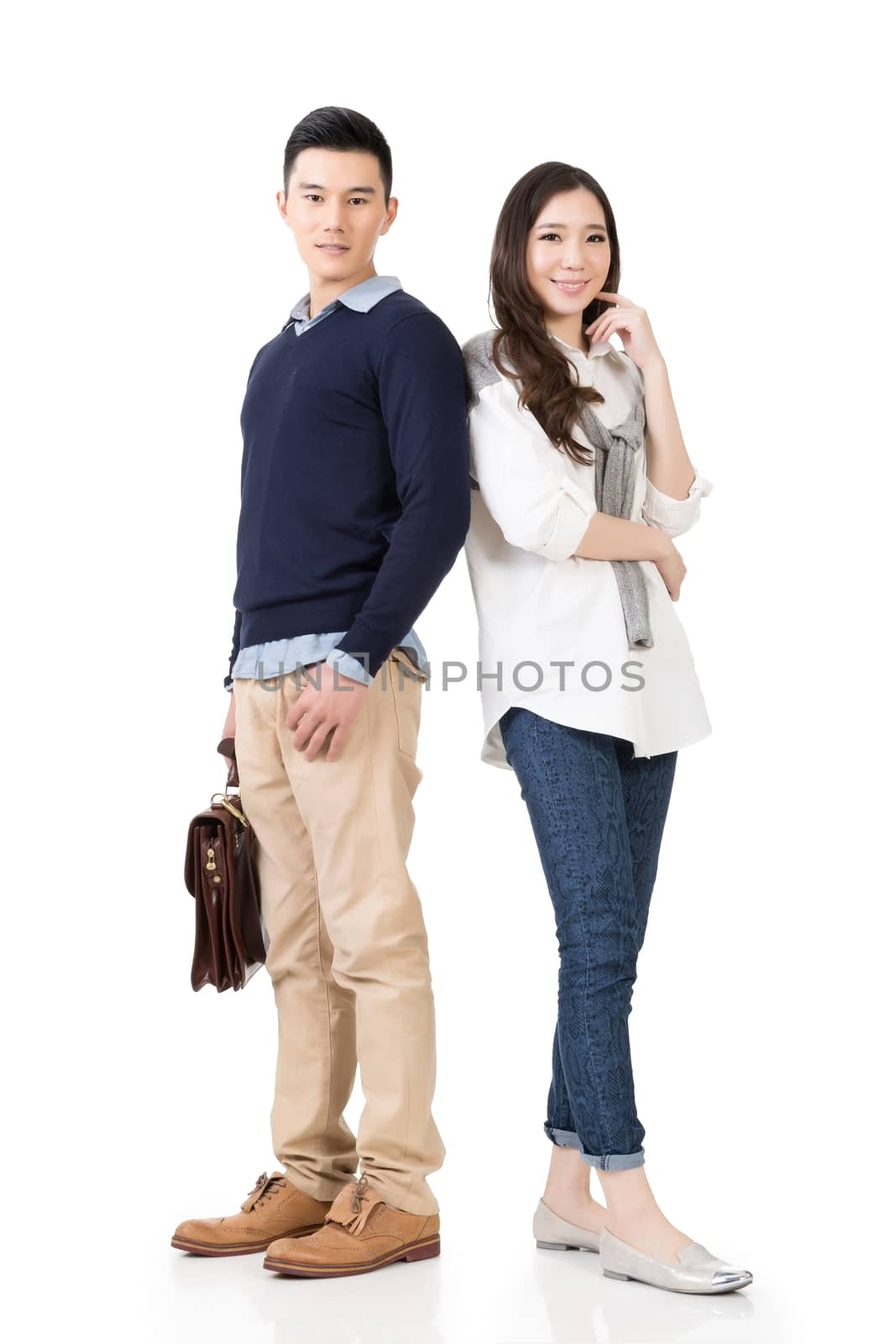 Young attractive Asian couple, full length portrait isolated on white.