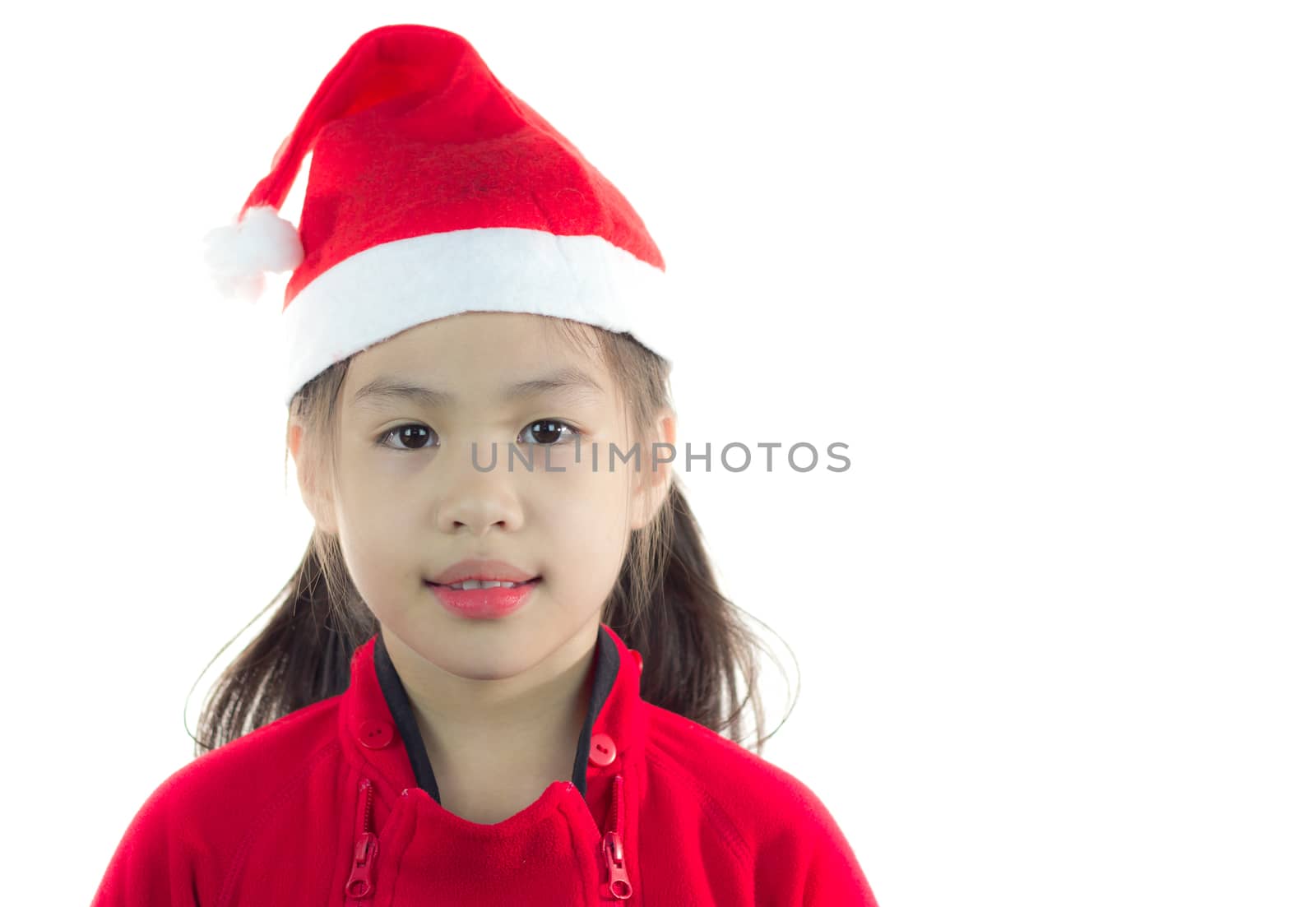 Little girl in the santa claus hat on white background