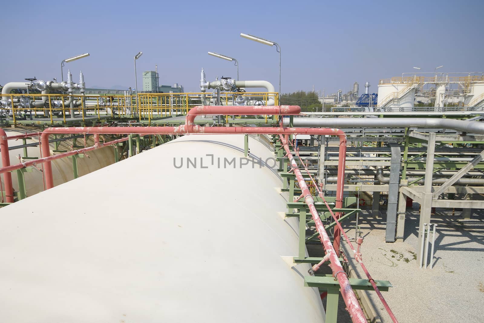 Gas storage tanks with blue sky in industrial plant