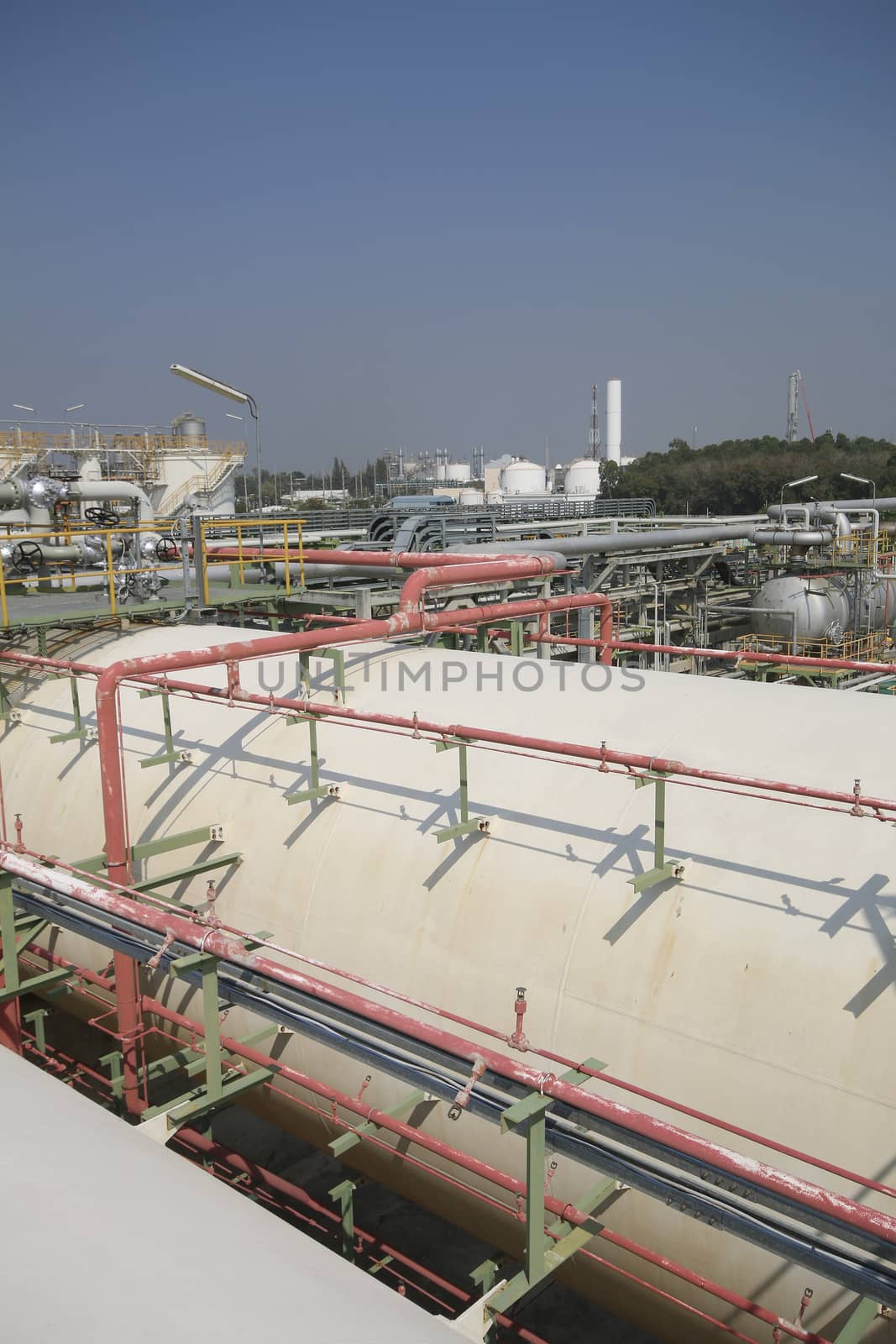 Gas storage tanks with blue sky in industrial plant