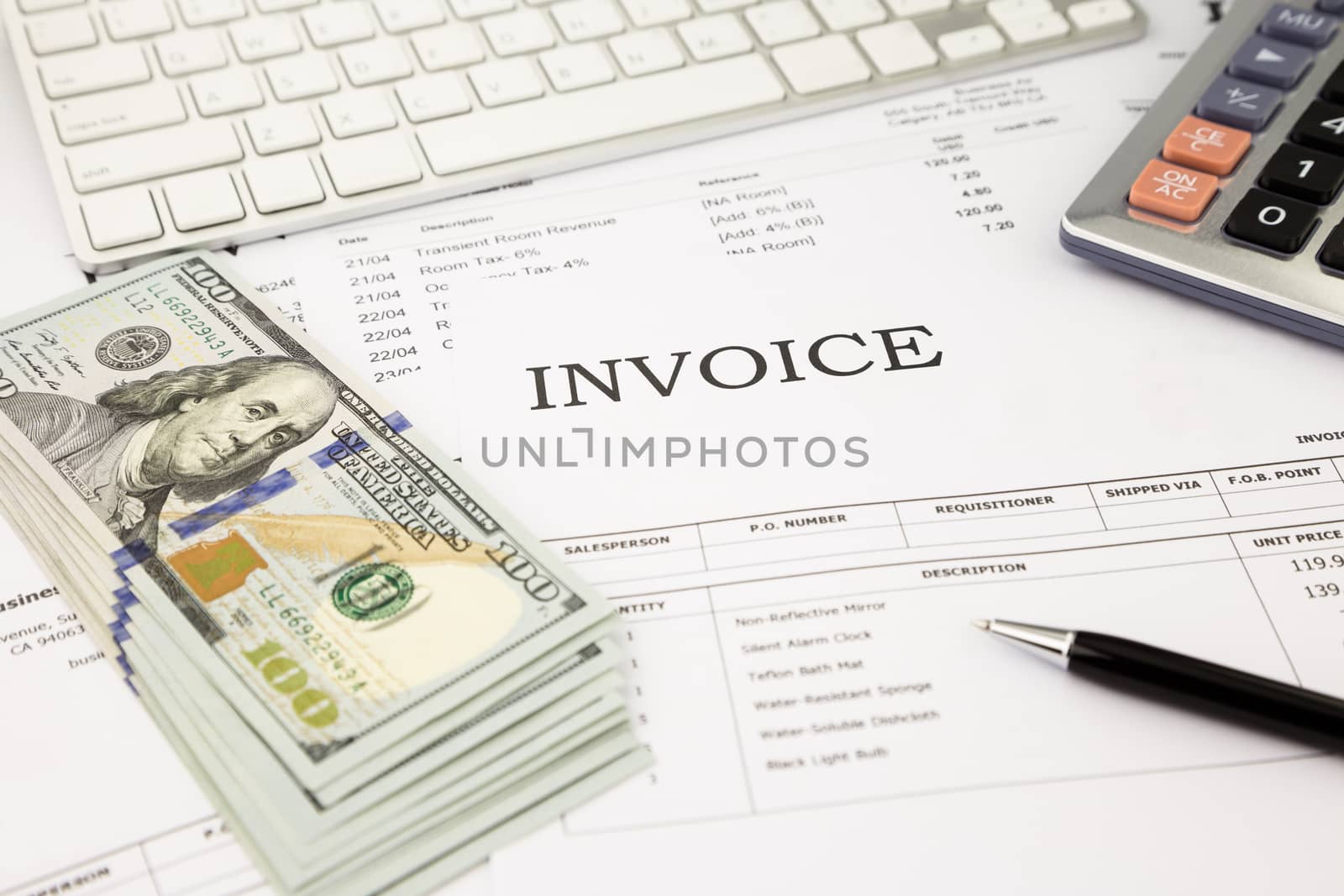 invoice documents  and dollar money banknotes on office table by vinnstock