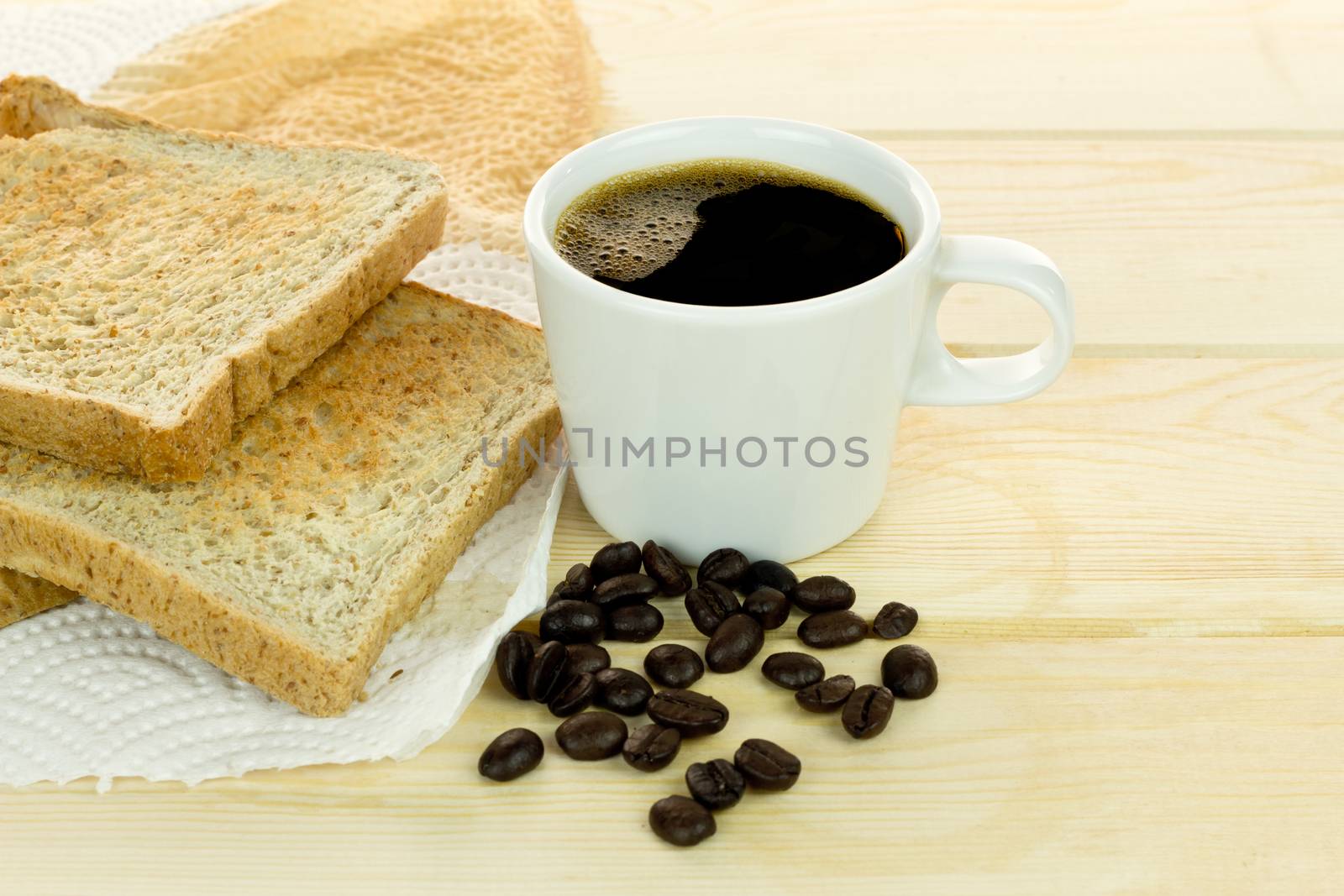 Delicious breakfast with fresh hot coffee, and whole grain bread. on wood background