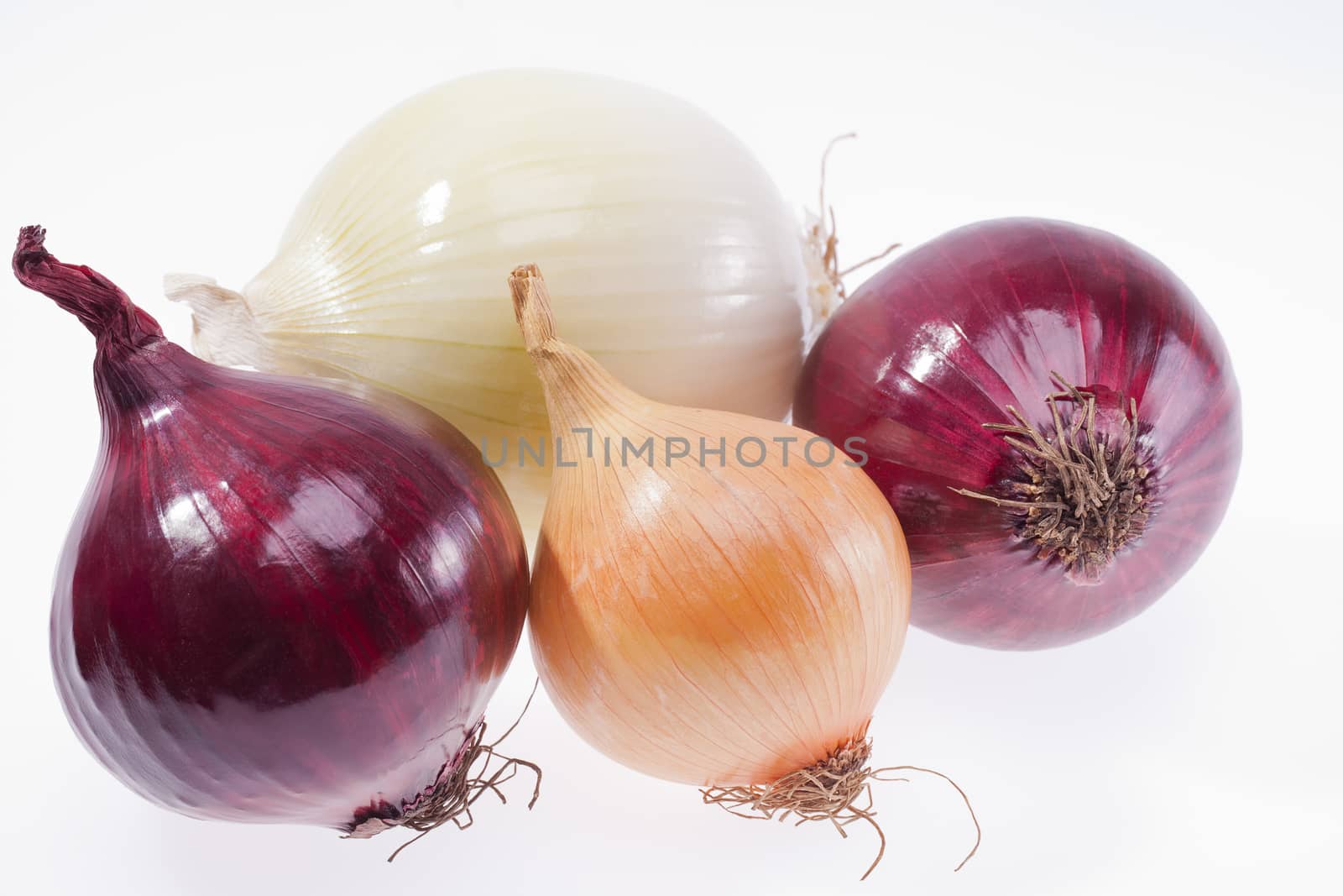 group of colorful onions isolated on white background