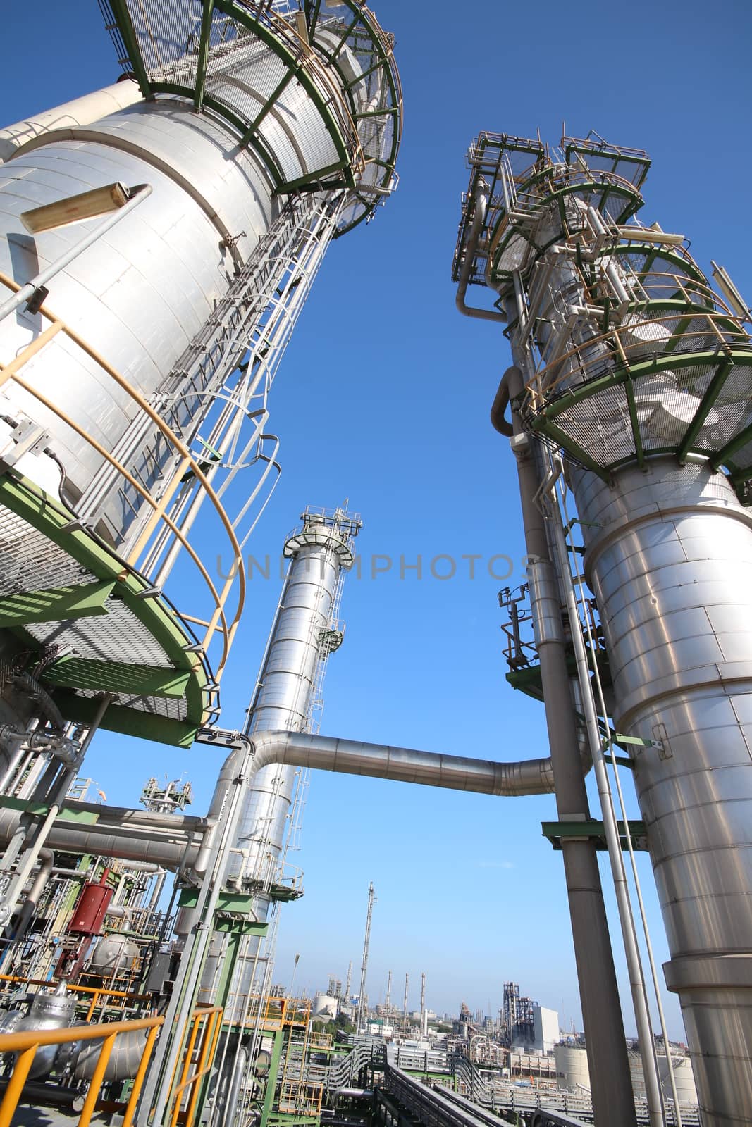 Refinery tower in petrochemical plant with blue sky 
