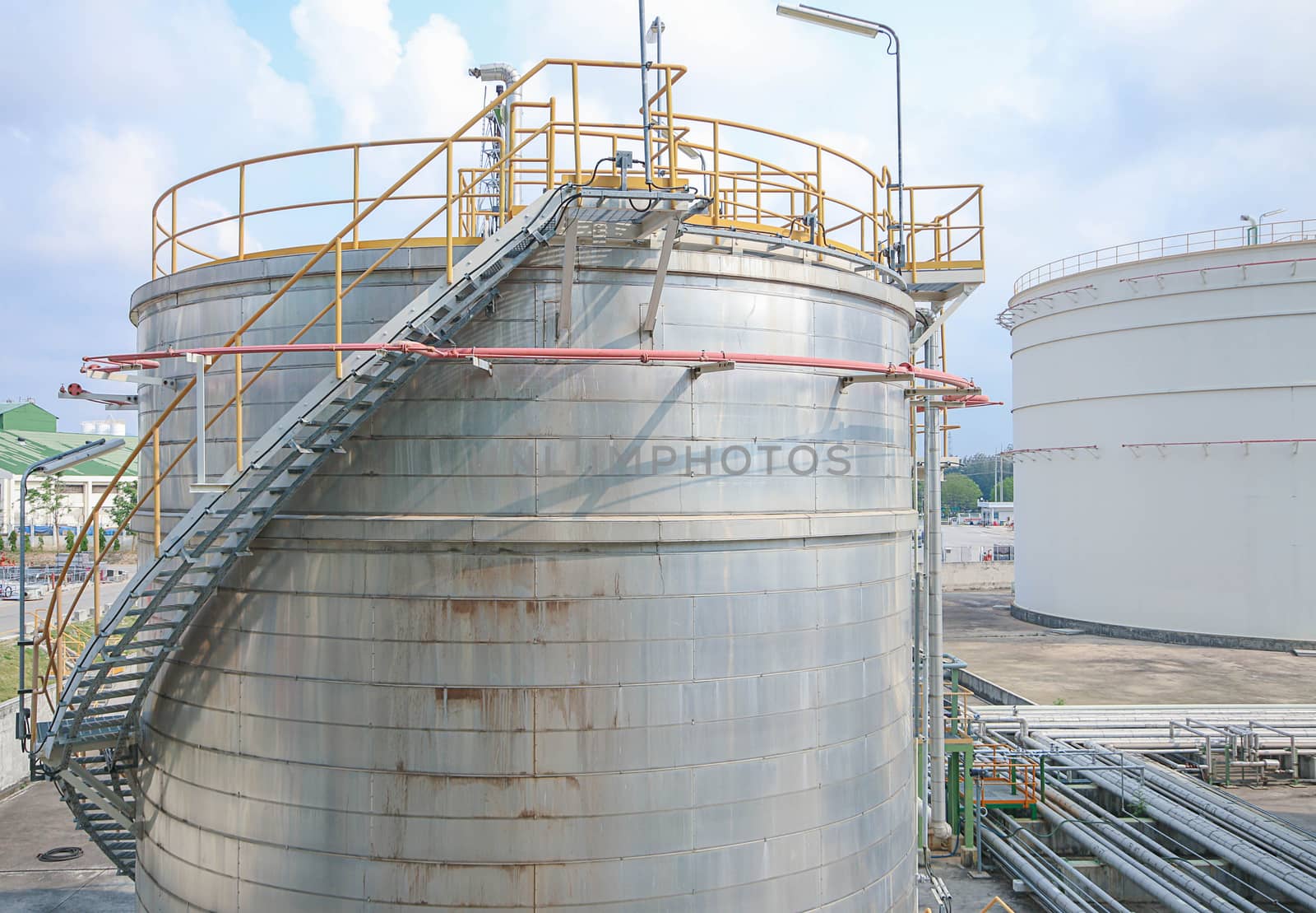 Tank storage in chemical factory with blue sky in summer day 