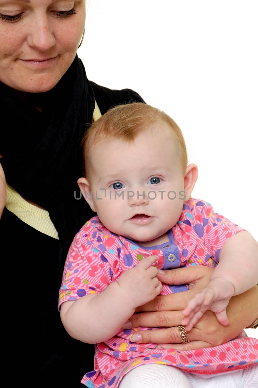 Woman is looking down on her sweet baby. Taken on a white background.