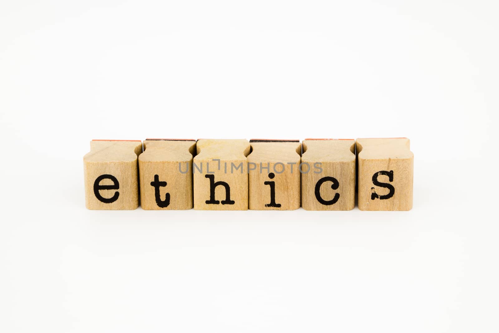 closeup ethics wording isolate on white background