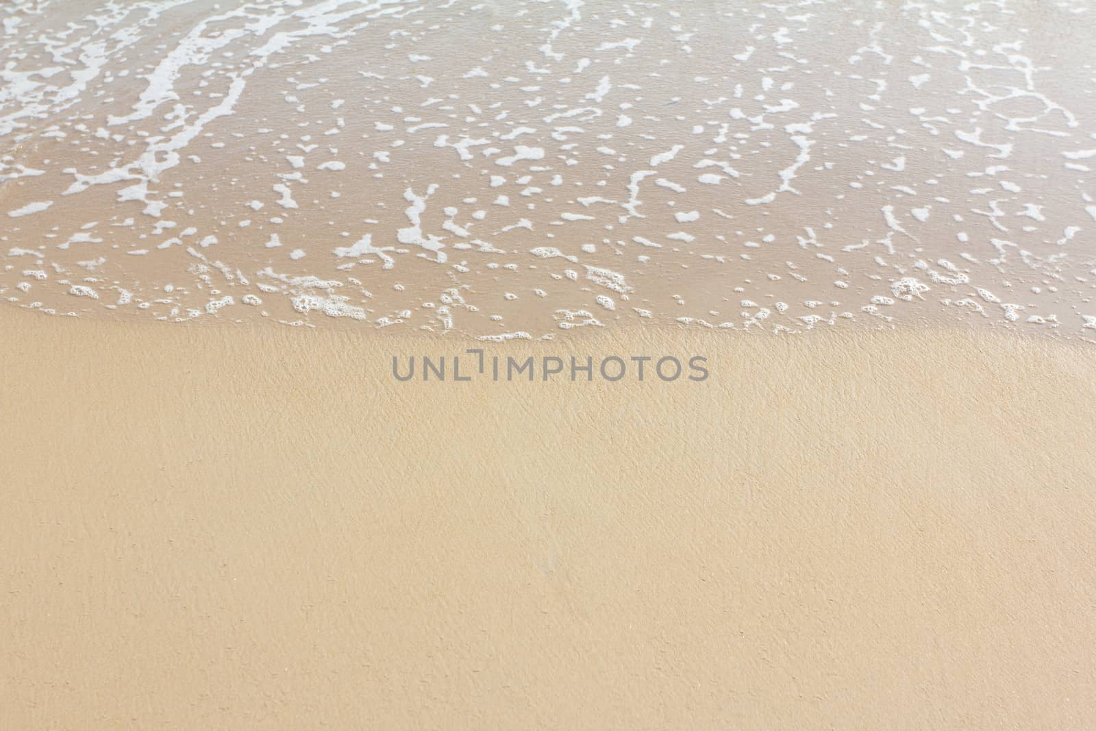 Wet sand on beach by wyoosumran