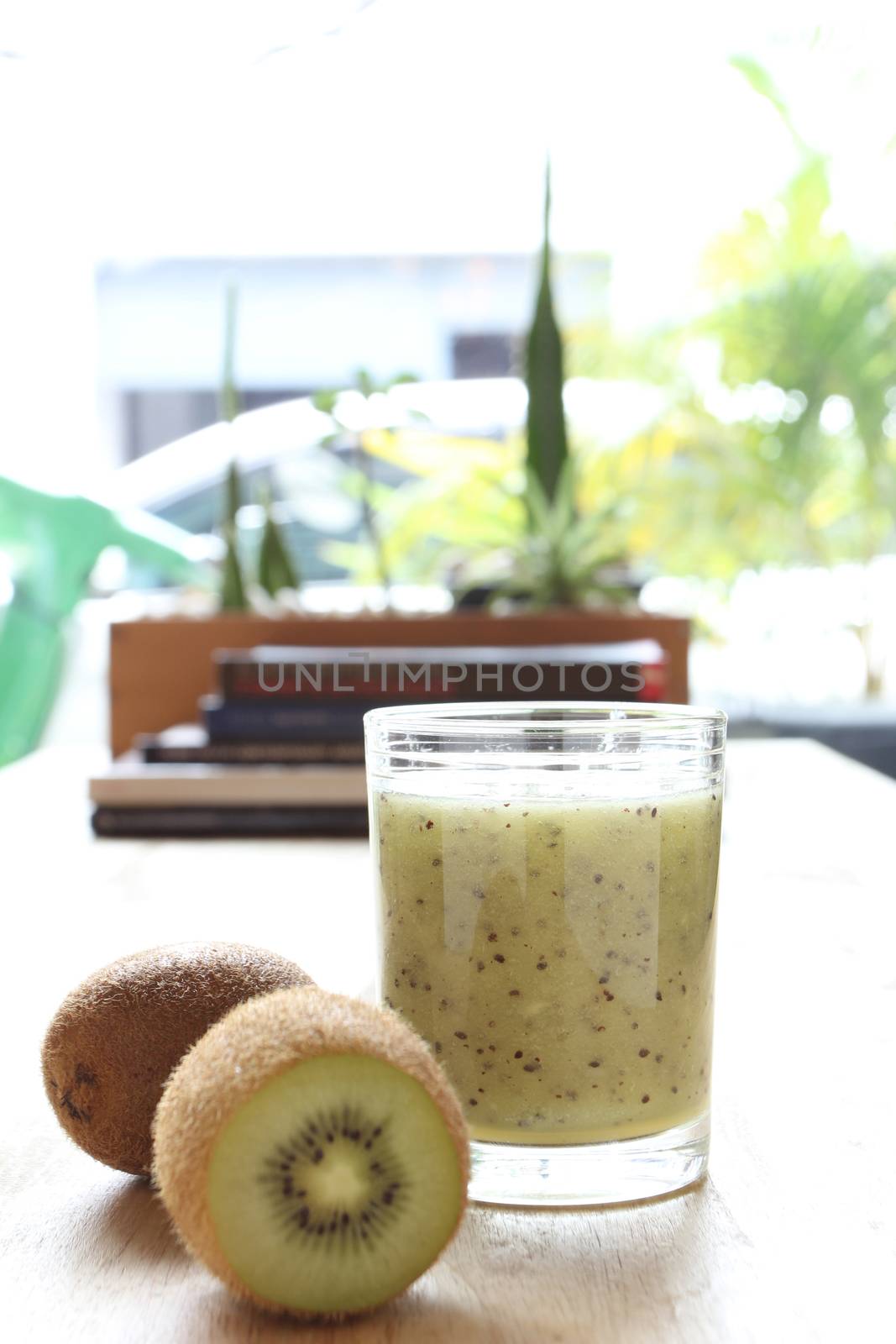 Kiwi smoothie and kiwi fruit wood background 