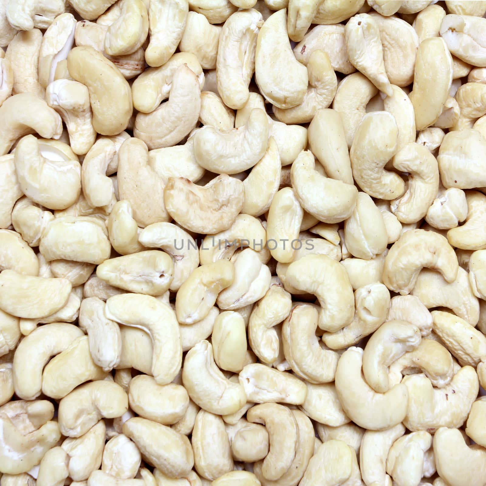 Cashew nuts closeup by wyoosumran