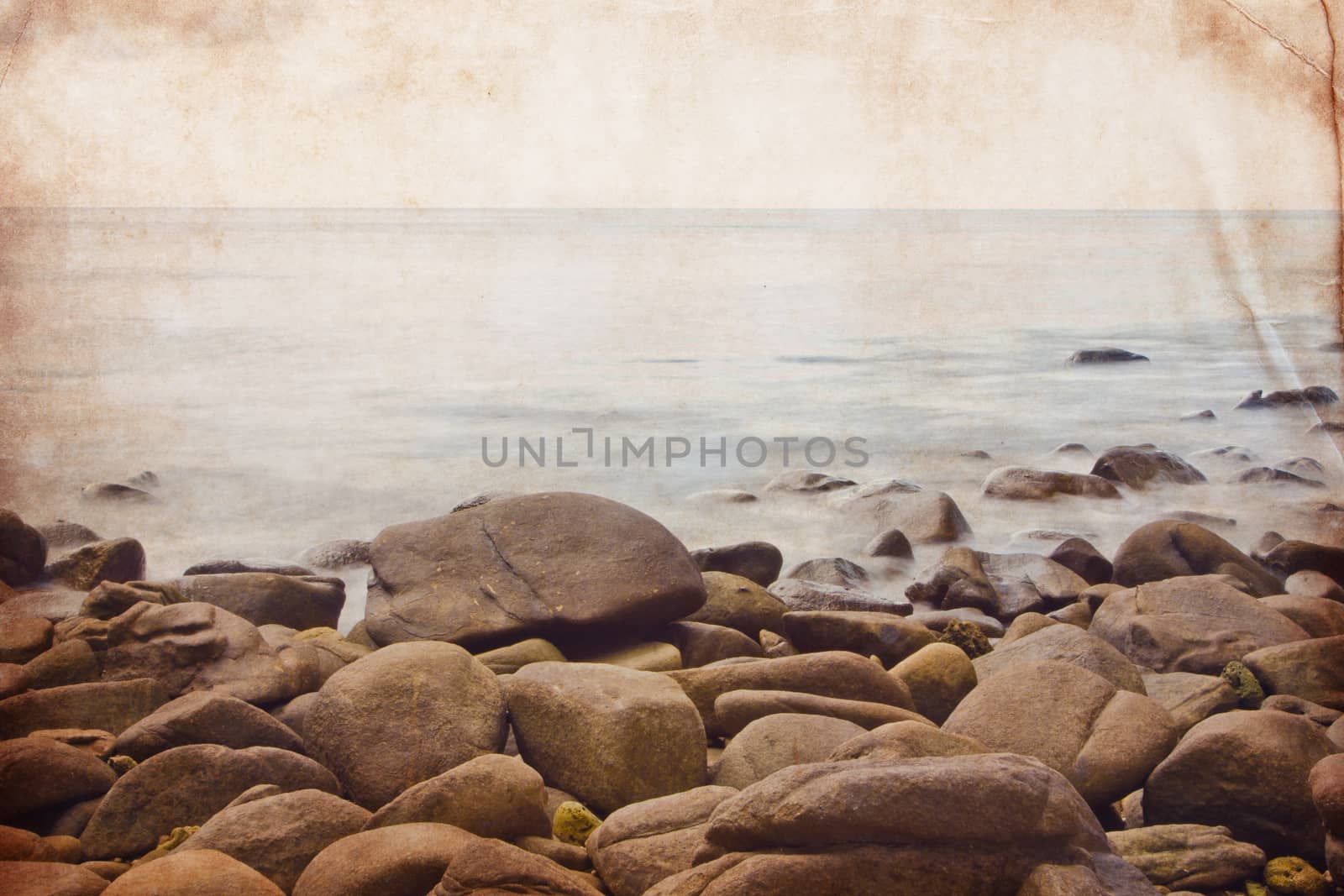 Ocean and rocky coast in retro grunge style for background