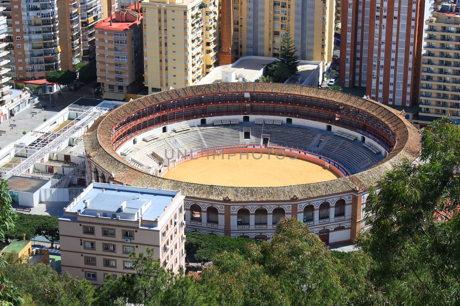 Bullring surrounded by buildings and trees in Malaga, Spain