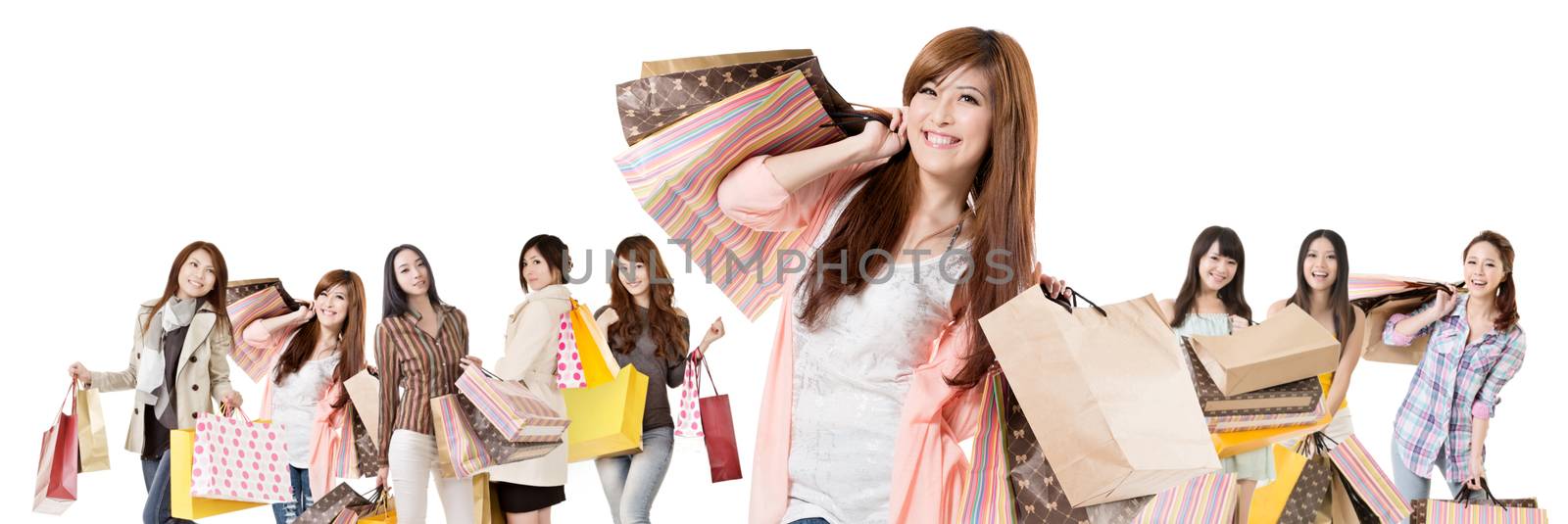 Happy Asian shopping girls on white background.