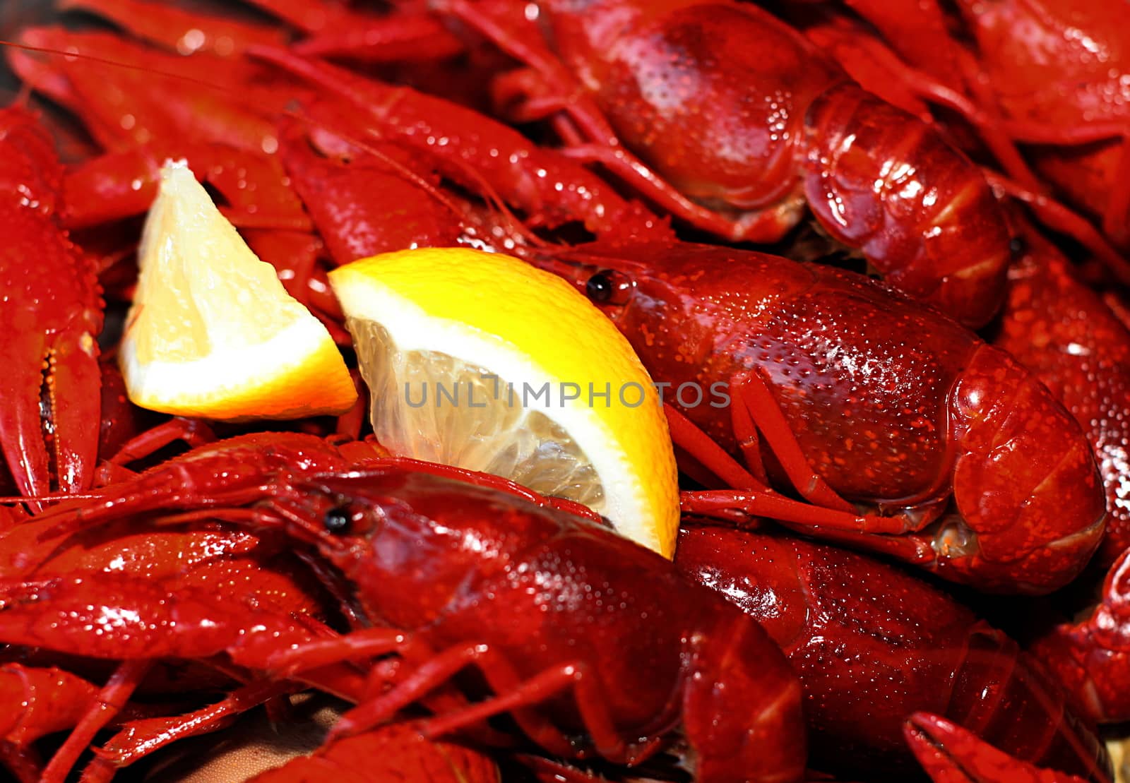 Red cooked crawfish complete with a chunk of lemon