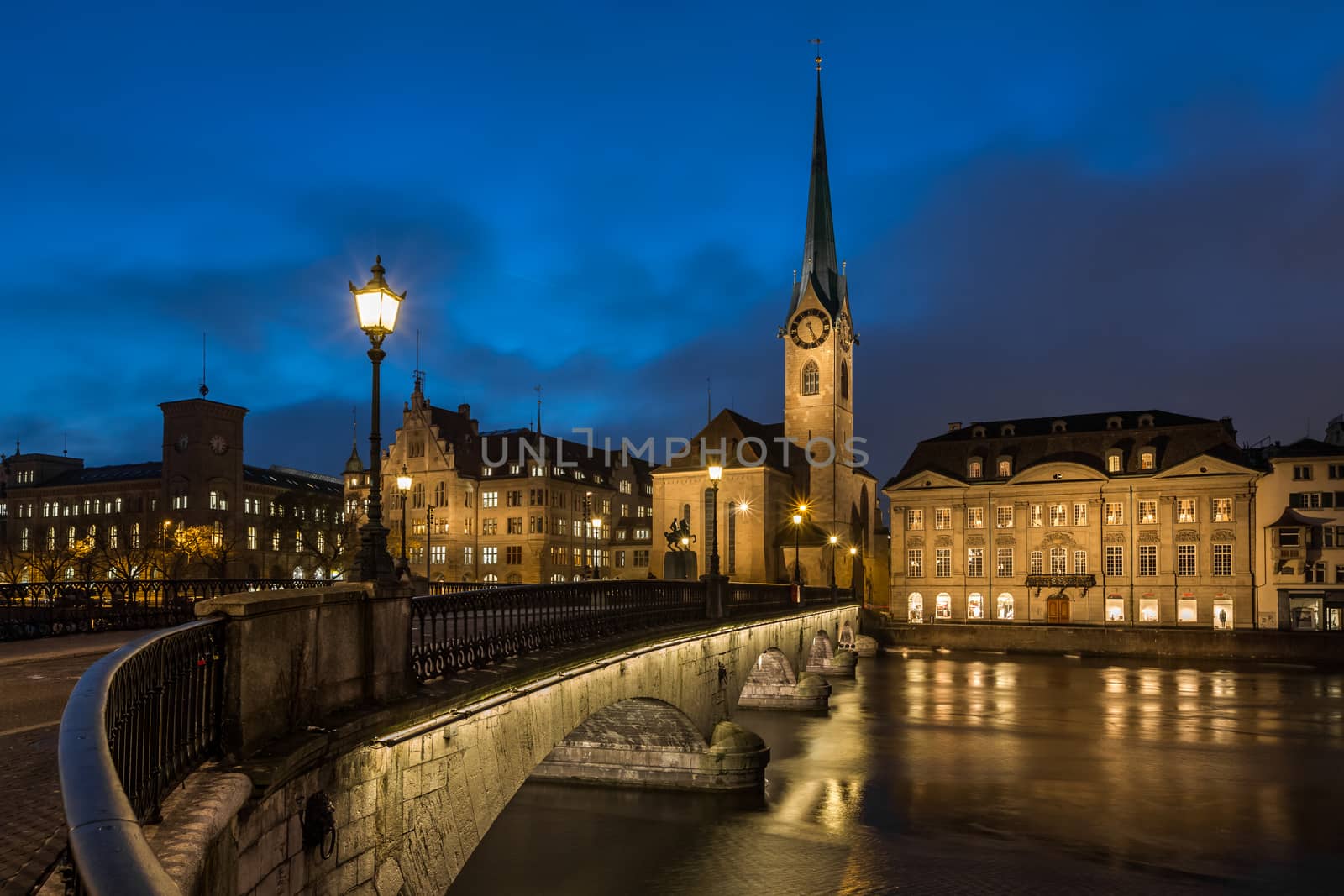 Illuminated Fraumunster Church and River Limmat in Zurich, Switz by anshar