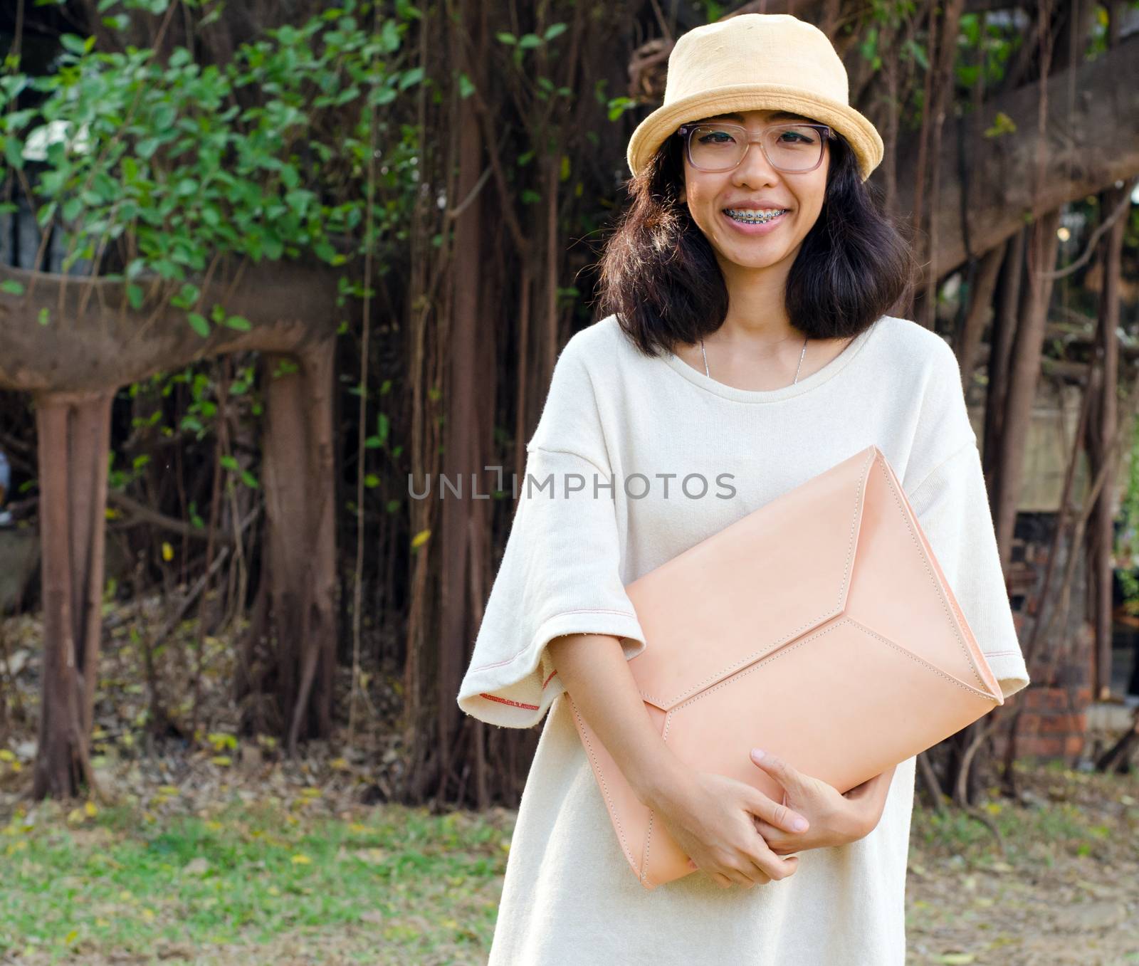 Young fashion girl with handbag  by siraanamwong
