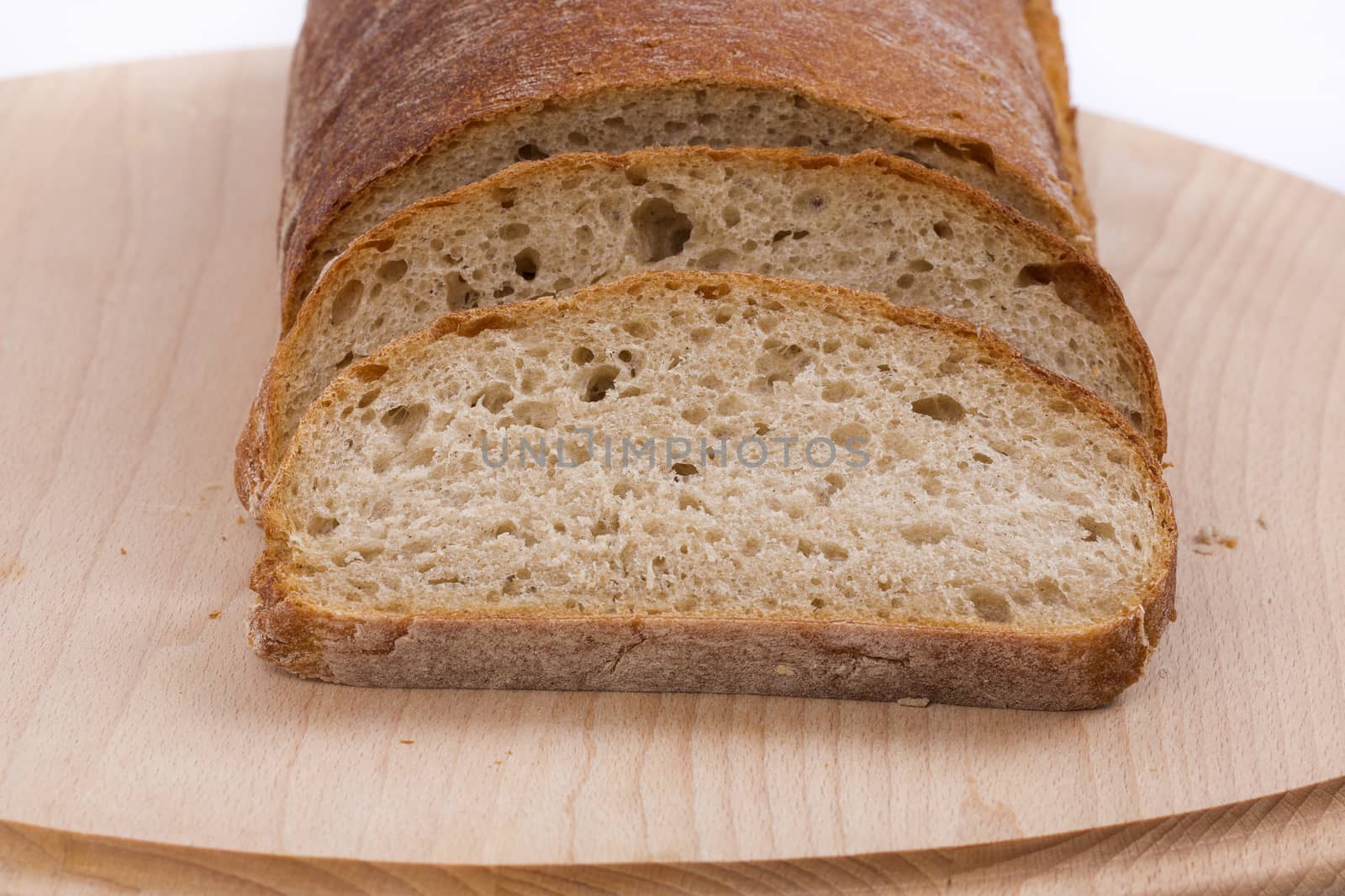 Fresh sliced bread on a wooden board