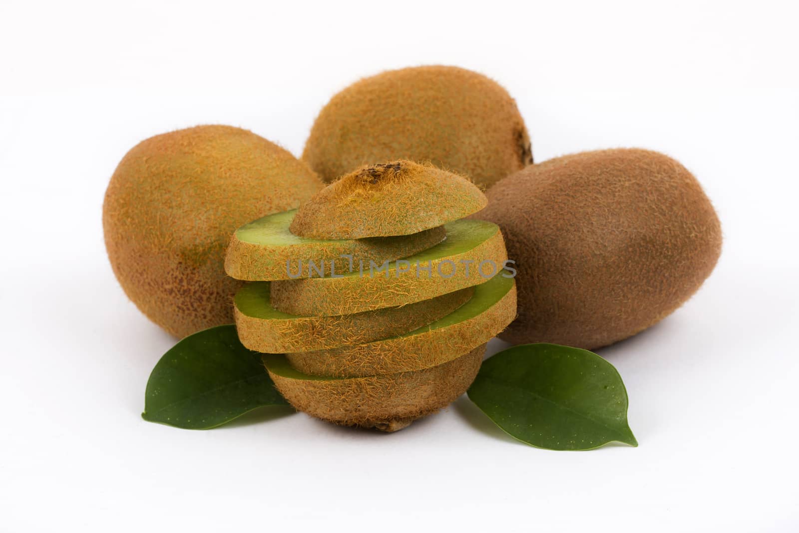 Fresh kiwi with slices and leaves