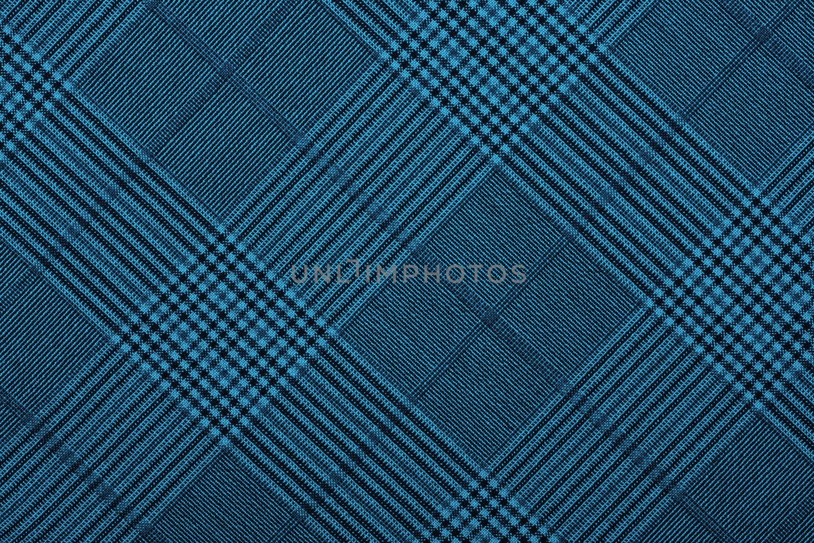 Blue material in geometric patterns, a background or texture