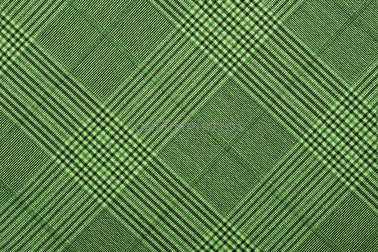 Green material in geometric patterns, a background or texture