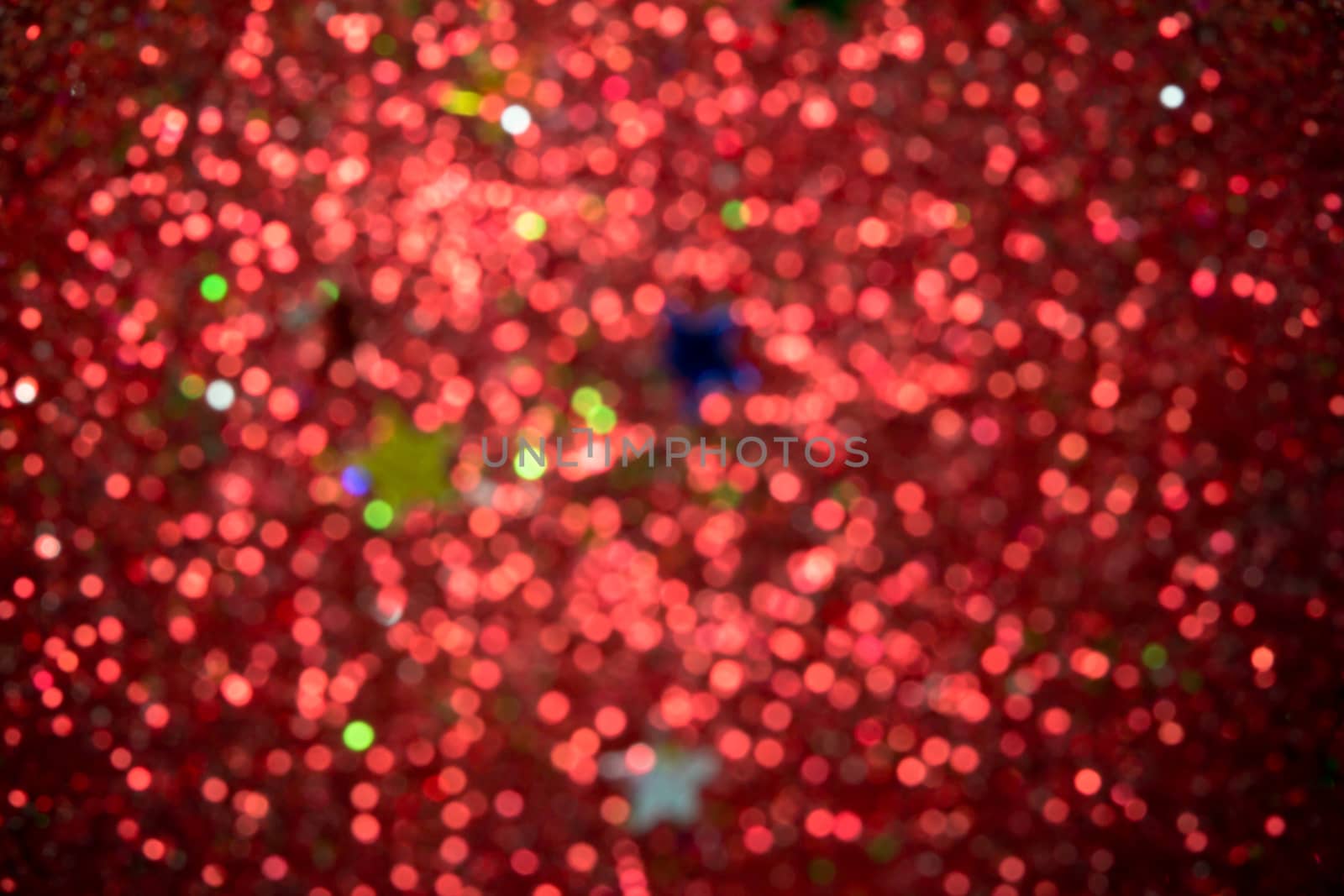 Red and green holiday bokeh. Abstract Christmas background by wyoosumran