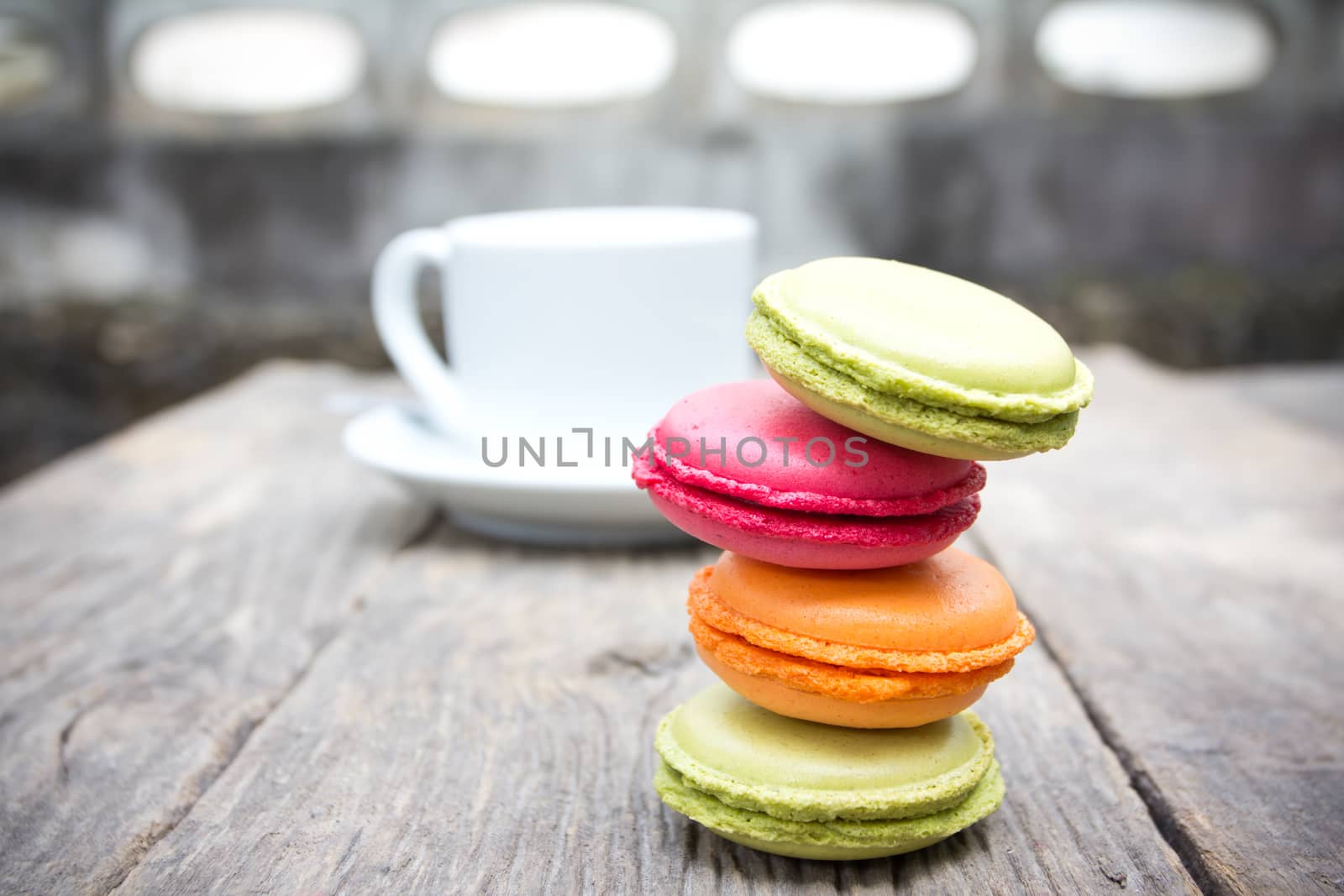 Macaroons on a wooden table  by wyoosumran