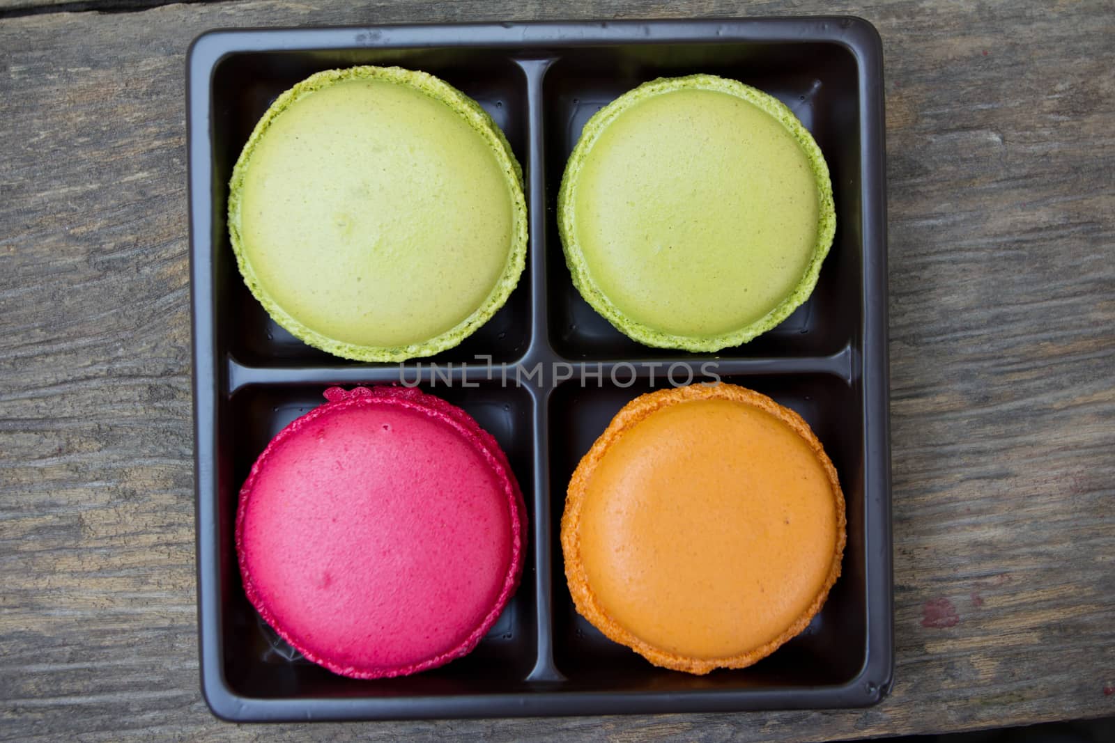 Macaroons on a wooden table view top
