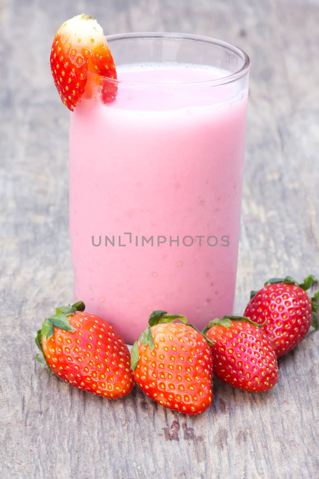 Smoothie Strawberry and fresh strawberry on old wood 