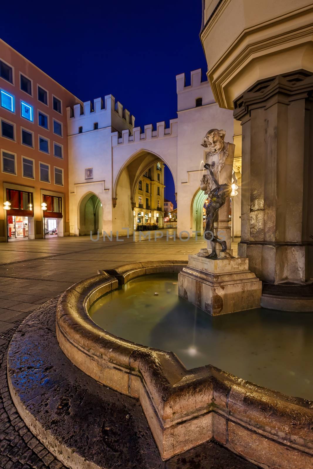Brunnenbuberl Fountain and Karlstor Gate in the Evening, Munich, by anshar