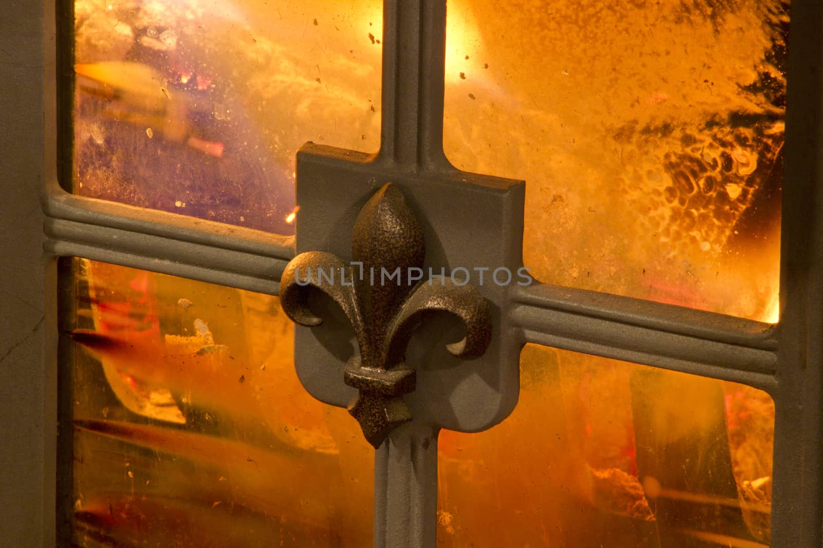 Fire place detail of a fire burning inside.