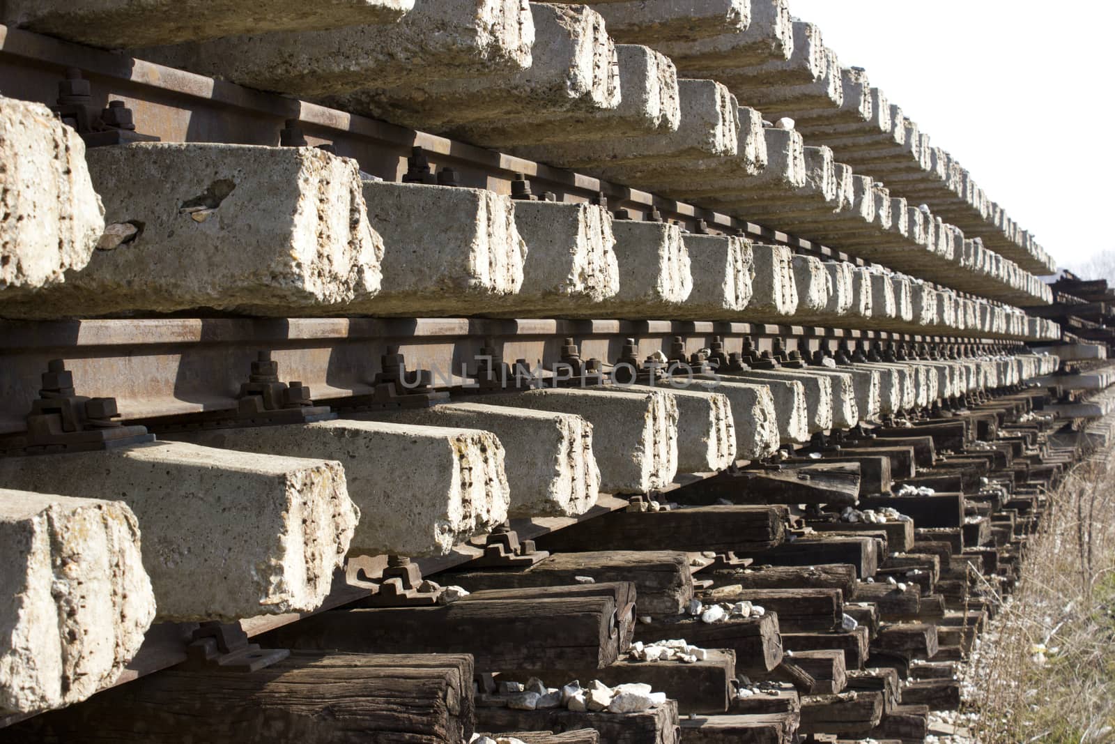 Railroad metal train tracks shot at perspective view.