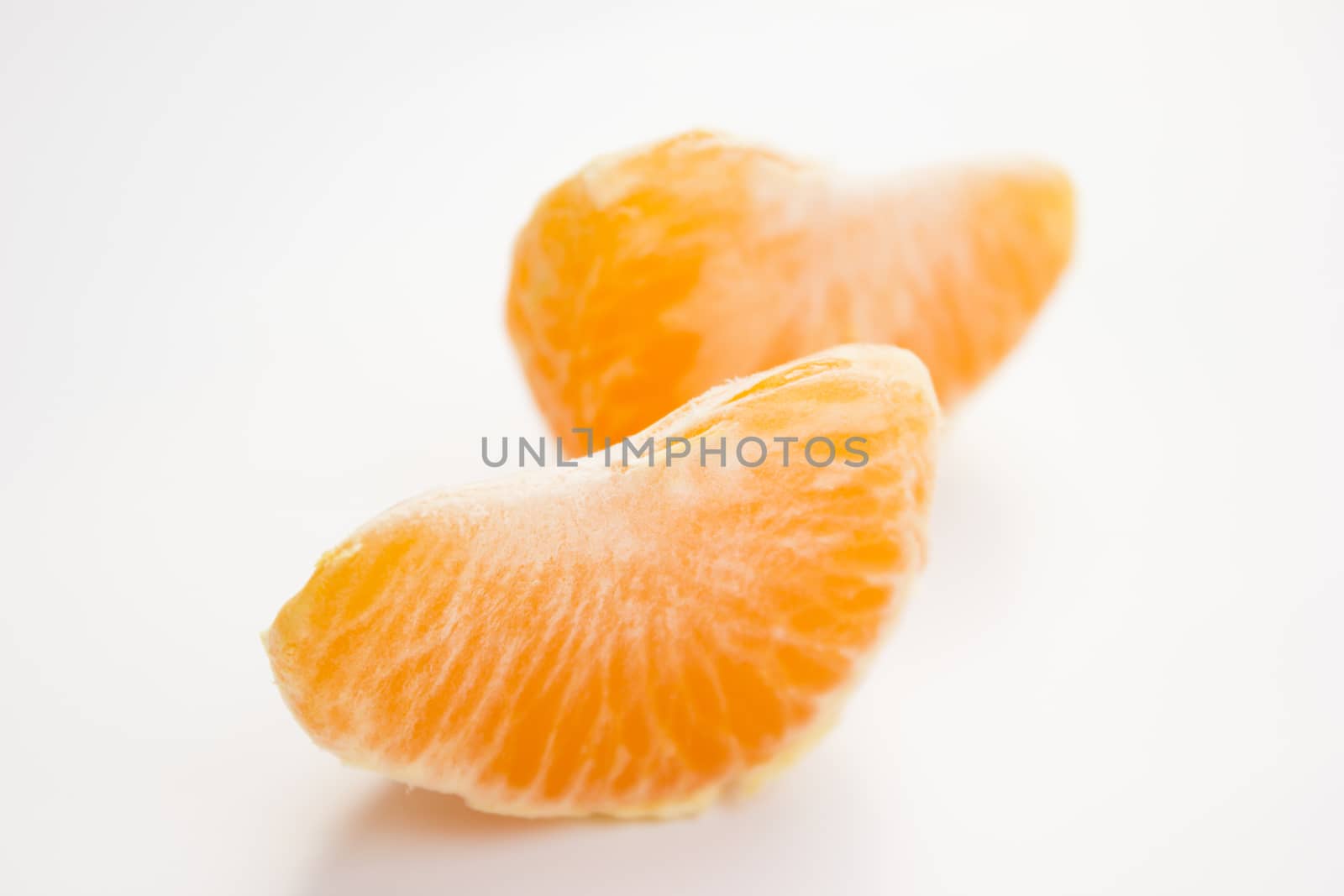 Vibrant mandarin fruit on a white background.