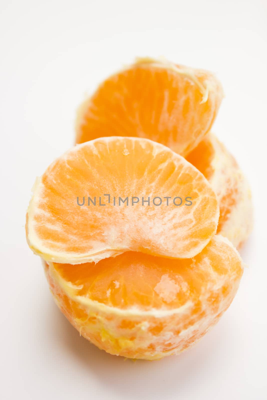 Vibrant mandarin fruit on a white background.