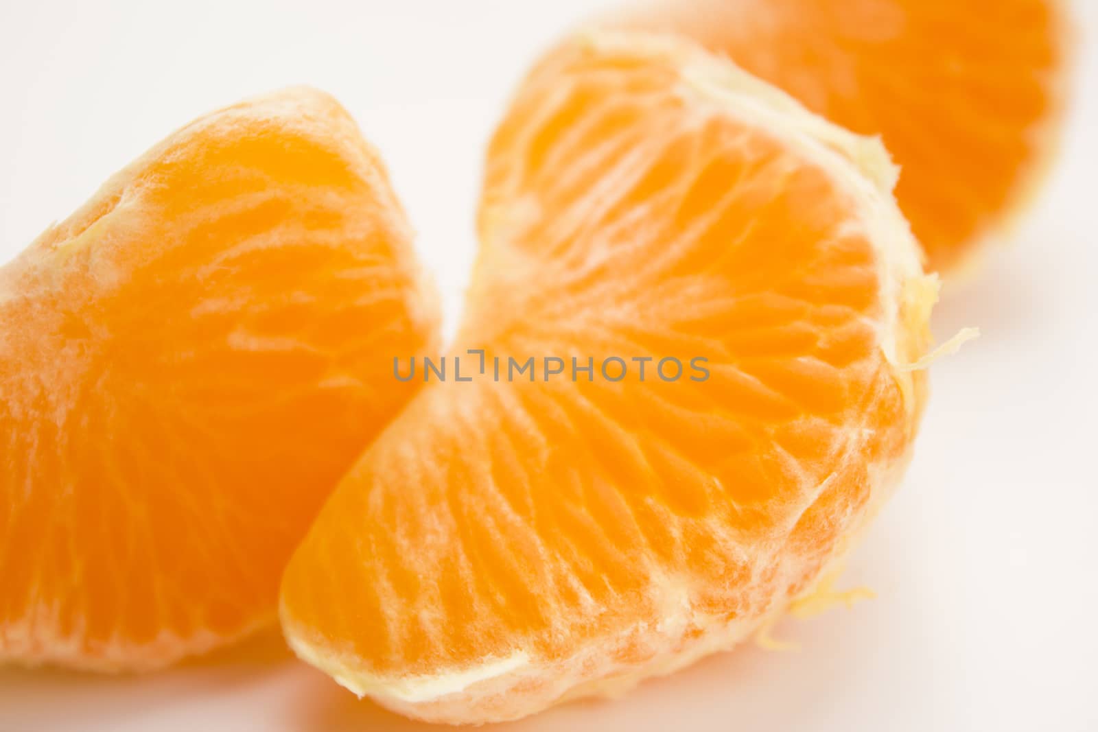 Vibrant mandarin fruit on a white background.