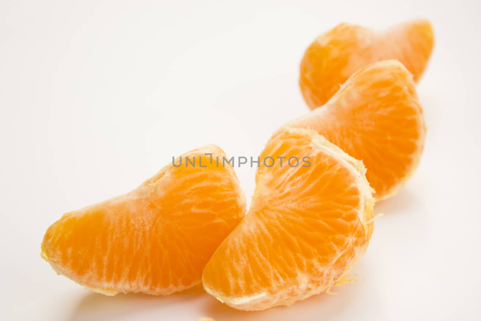 Vibrant mandarin fruit on a white background.